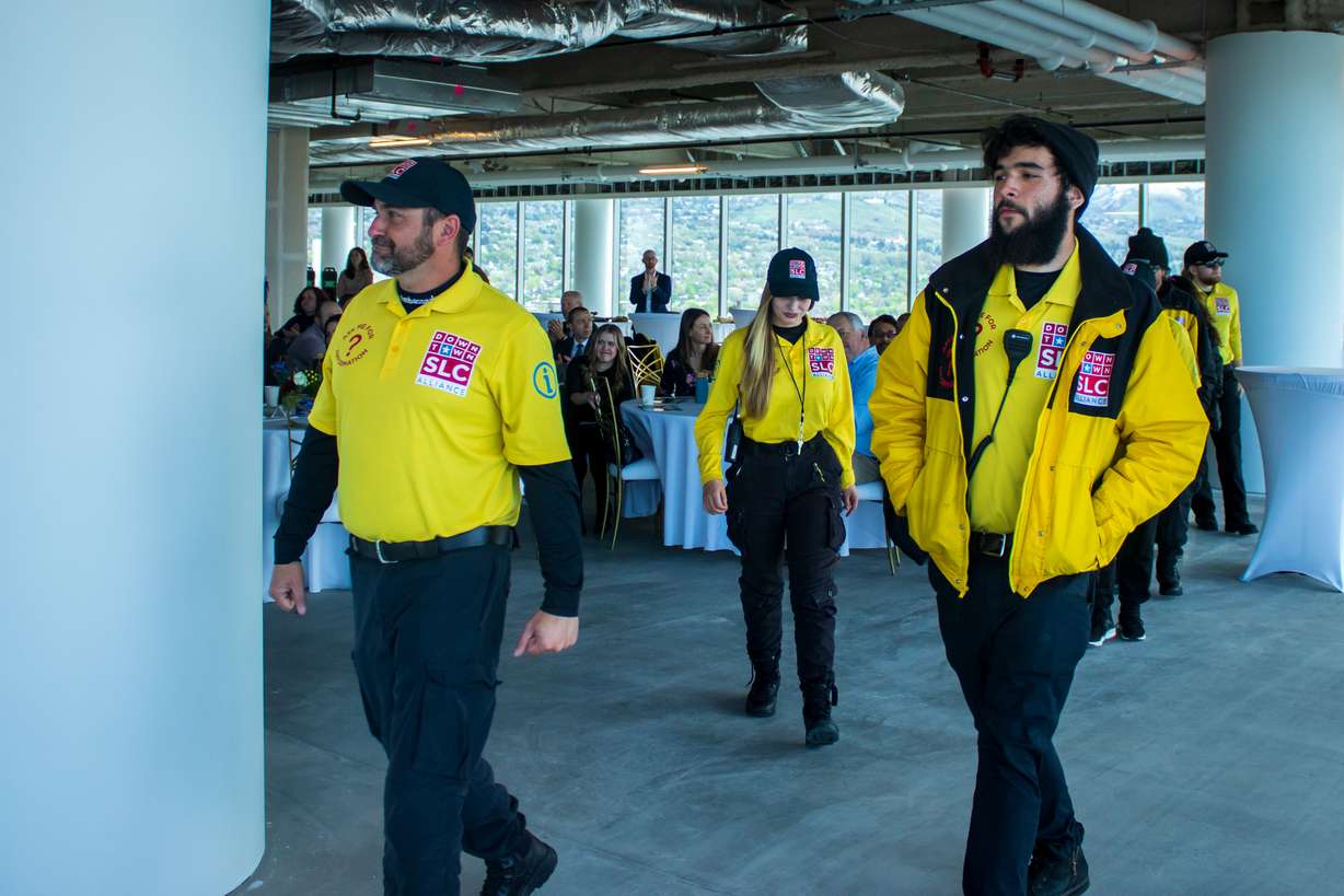 Members of Salt Lake City's street ambassadors program walk up to accept an award during the Salt Lake City Downtown Alliance "State of Downtown" ceremony Thursday morning.
