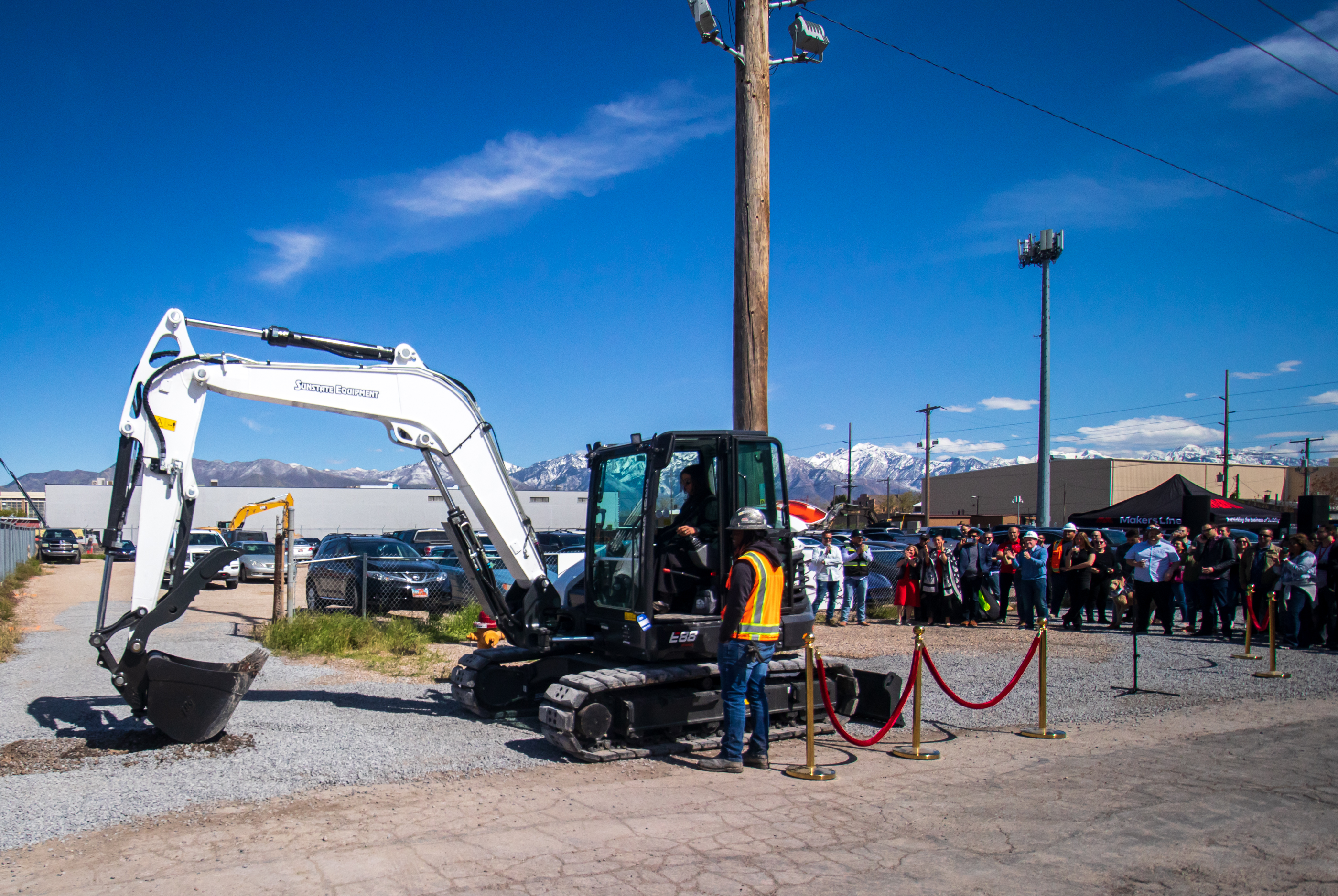 Ellen Winkler, co-founder of Industry, scoops gravel to signify the beginning of a new parking garage in Salt Lake City's Granary District Thursday afternoon. The parking garage is expected to add 1,000 stalls in a growing part of the city.