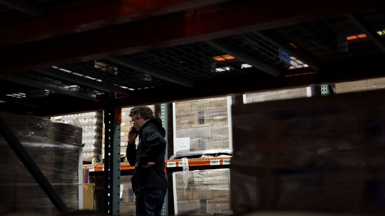 Warehouse employee Adam Waite manages the stocking procedure at the Utah Food Bank in Salt Lake City on May 5.