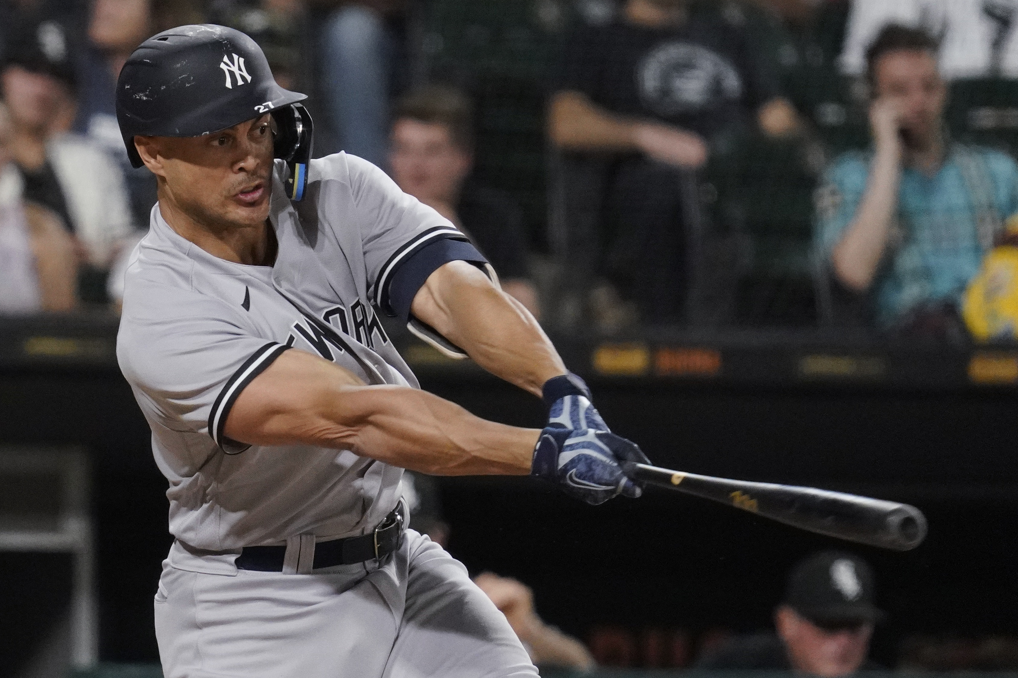New York Yankees' Giancarlo Stanton hits a two-run single against the Chicago White Sox during the eighth inning of a baseball game in Chicago, Thursday, May 12, 2022. 