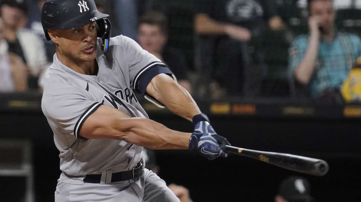 New York Yankees' Giancarlo Stanton hits a two-run single against the Chicago White Sox during the eighth inning of a baseball game in Chicago, Thursday, May 12, 2022.