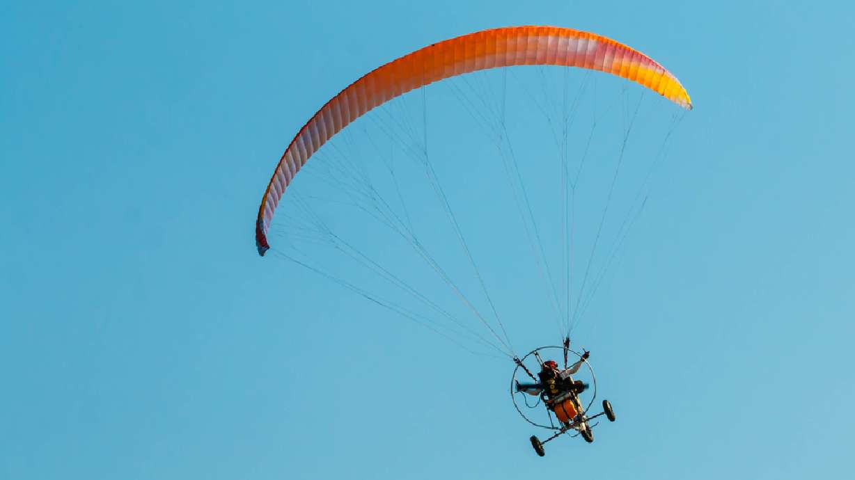 A photo of powered paraglider flying. Powered paragliding, paramotor and flying ultralight aircraft or any similarly-sized aircraft are now banned within most of the Glen Powell Dam Recreation Area, park officials said Thursday.
