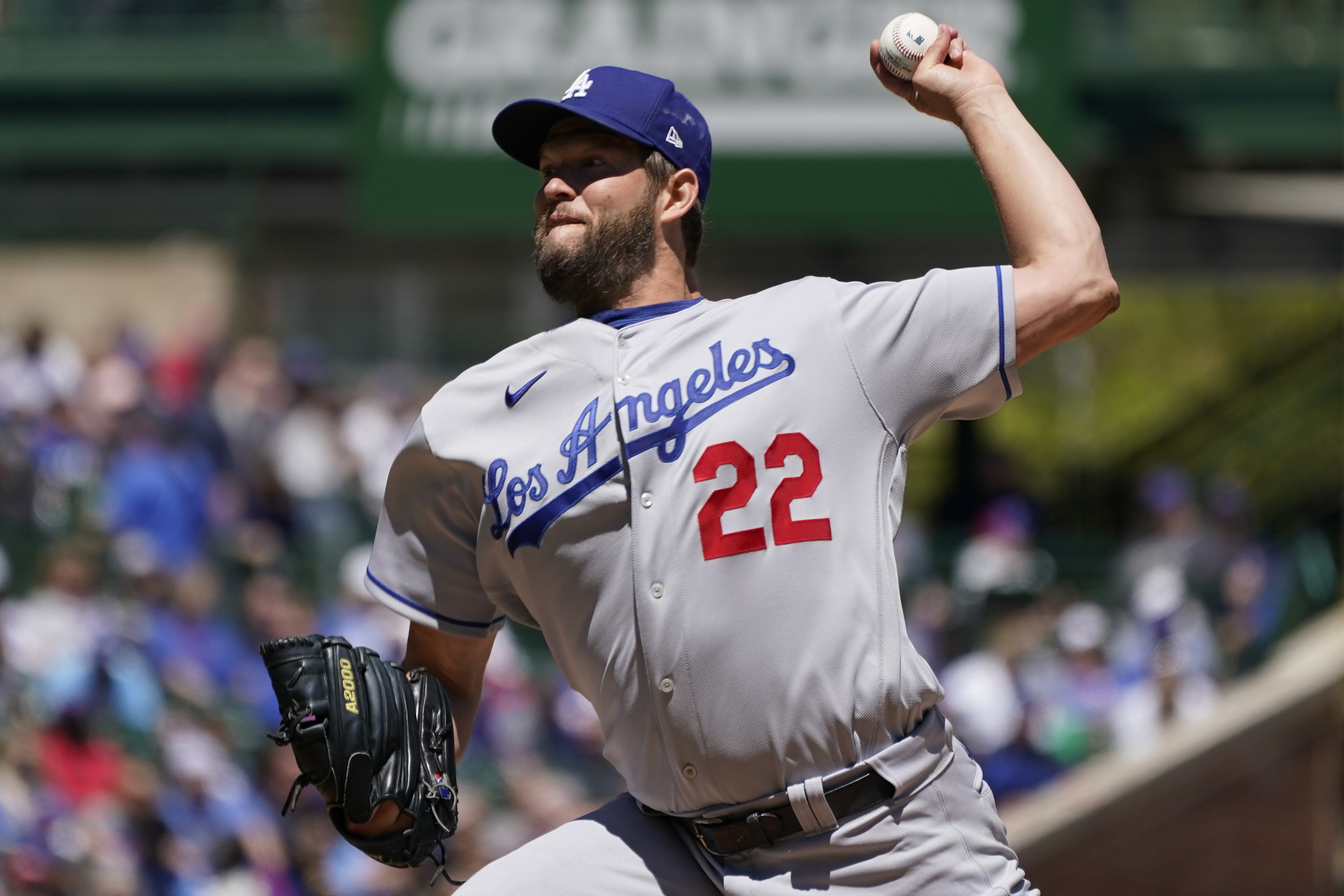 Los Angeles Dodgers starting pitcher Clayton Kershaw throws against the Chicago Cubs during the first inning in the first baseball game of a doubleheader, Saturday, May 7, 2022, in Chicago.