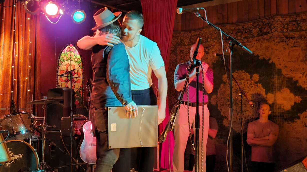 Imagine Dragons singer Dan Reynolds embraces Velour Live Music Gallery owner Corey Fox in May 2022. Velour will be highlighted in NPR's World Cafe, a series that highlights emerging artists of musical hotspots.