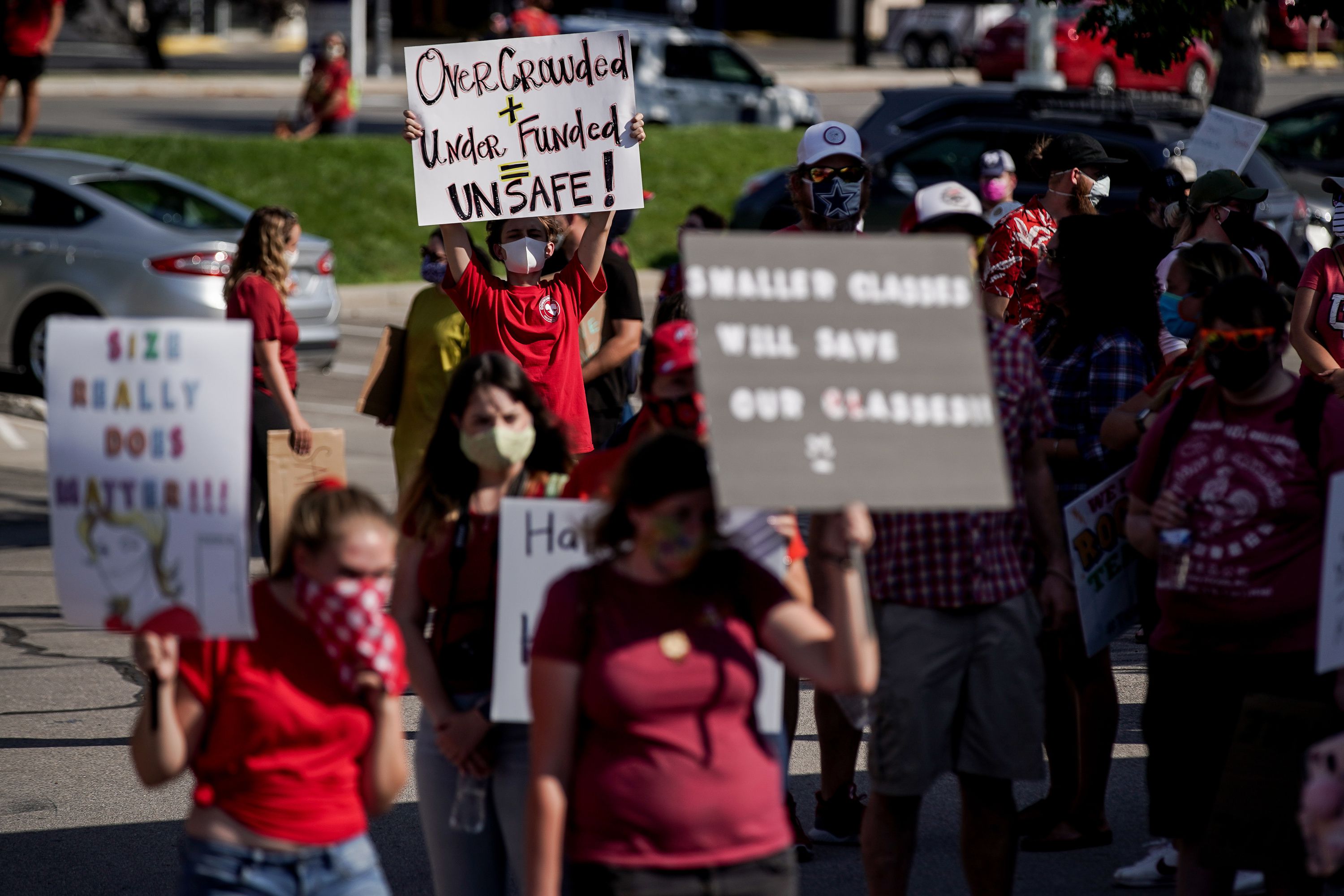Granite School District teachers, staff and supporters protest outside of the district office in South Salt Lake on Aug. 4, 2020. A new national poll says teacher satisfaction is at its lowest point in about 40 years.