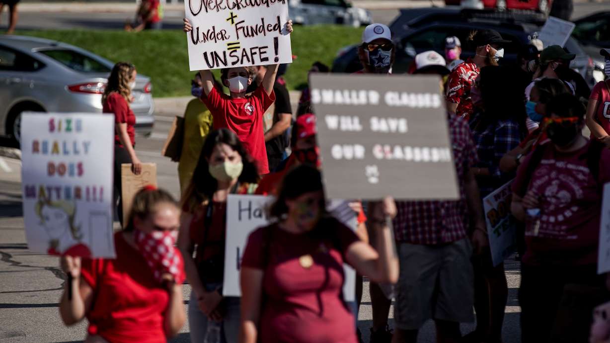 Granite School District teachers, staff and supporters protest outside of the district office in South Salt Lake on Aug. 4, 2020. A new national poll says teacher satisfaction is at its lowest point in about 40 years.