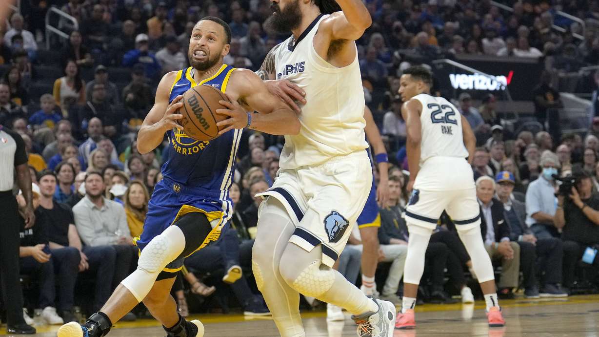 Golden State Warriors guard Stephen Curry drives to the basket against Memphis Grizzlies center Steven Adams during the first half of Game 6 of an NBA basketball Western Conference playoff semifinal in San Francisco, Friday, May 13, 2022.