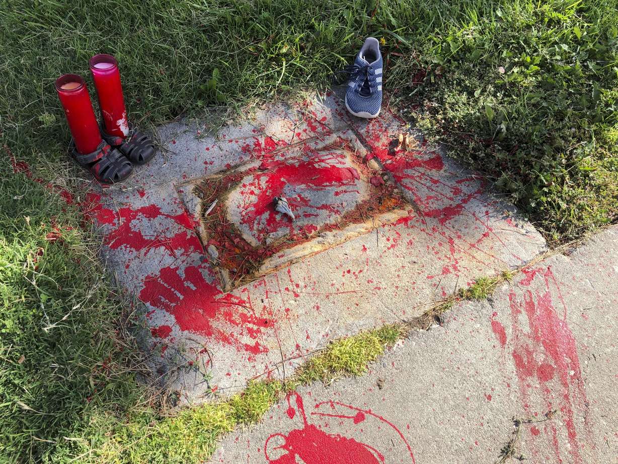 Red painted handprints cover the empty spot at a park in Albuquerque, New Mexico, on Thursday, July 1, 2021, where a historical marker for the Indigenous children who died while attending a boarding school nearby was removed. The Department of the Interior report, released Wednesday, May 11, 2022, says the federal government provided funding and other support to religious boarding schools for Native children in the 19th and early 20th centuries to an extent that normally would have been prohibited by bans on the use of federal funds for religious schools.