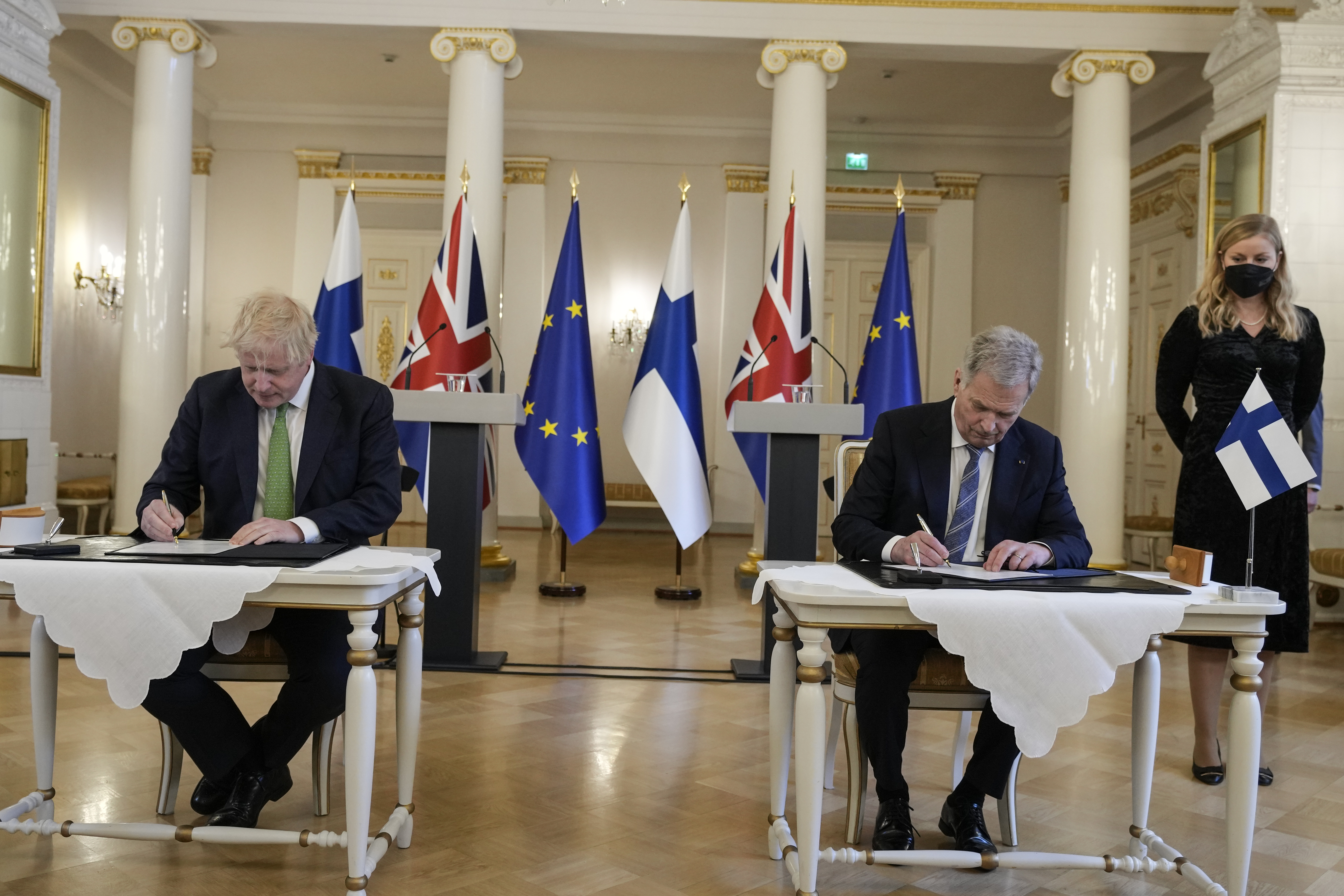 British Prime Minister Boris Johnson, left, and Finland's President Sauli Niinisto sign a security assurance, at the Presidential Palace in Helsinki, Finland, on Wednesday. Finland appears on the cusp of joining NATO. Sweden could follow suit. By year’s end, they could stand among the alliance’s ranks. Russia’s war in Ukraine has provoked a public about face on membership in the two Nordic countries. They are already NATO’s closest partners, but should Russia respond to their membership moves they might soon need the organization’s military support.