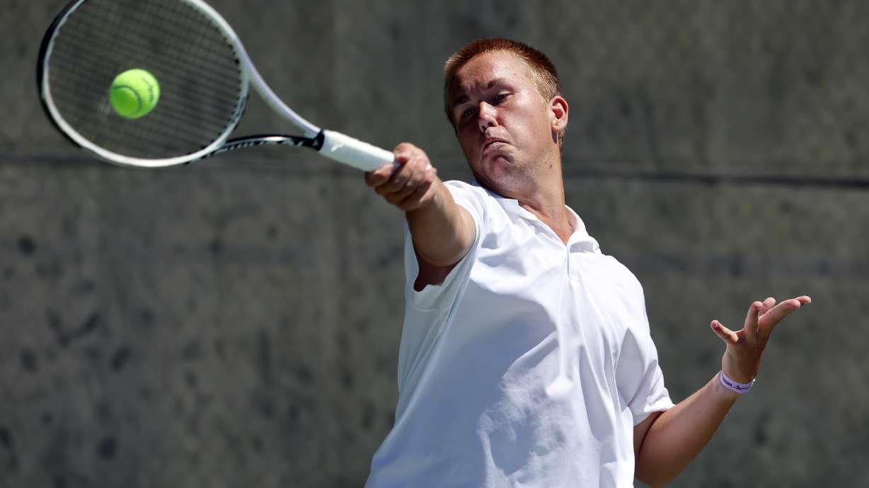 Crimson Cliff’s Liam Duffin, returns a ball as he competes with Pine View’s Kaden Koch in the High school boys 4A State Tennis Championships at Liberty Park in Salt Lake City on Saturday, May 14, 2022.