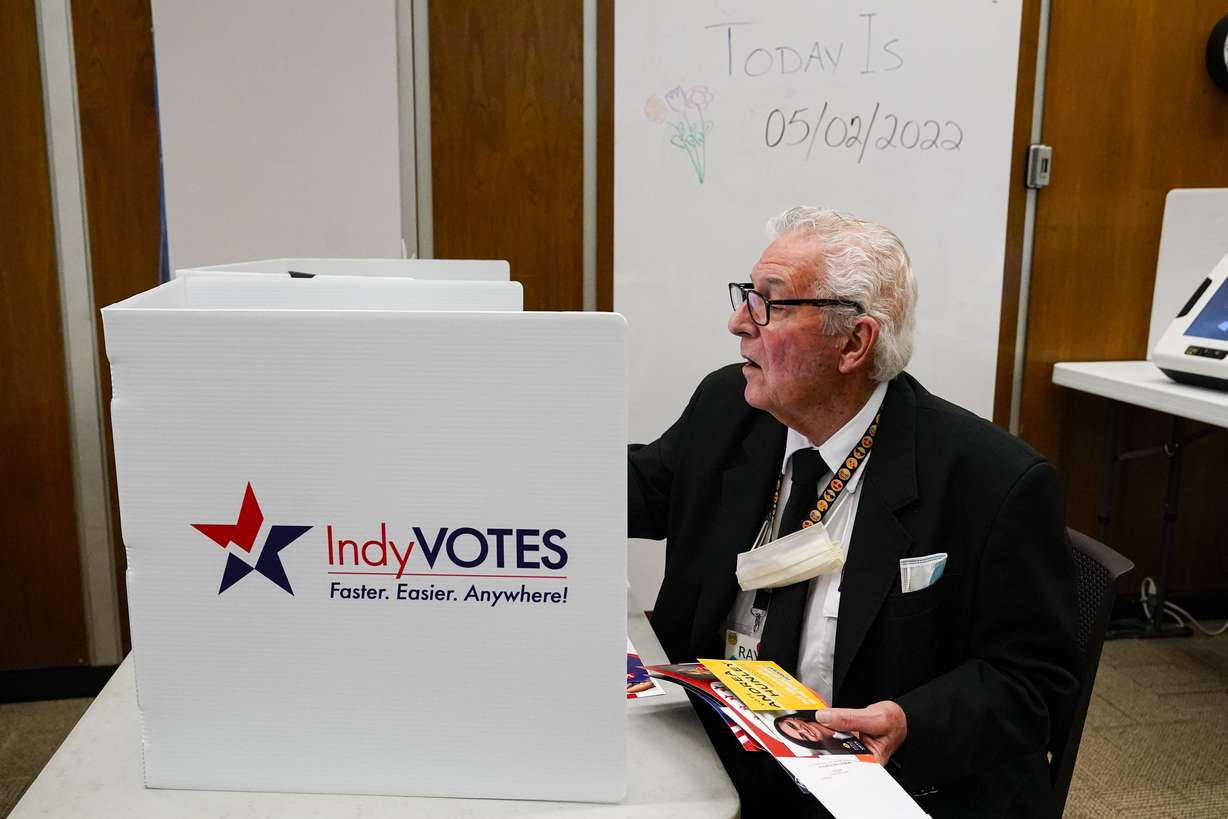 Raymond Broedel casts his ballot at the City-County Building in the final hours of early voting in the primary election in Indianapolis, Monday, May 2, 2022. The great vote-by-mail wave appears to be receding just as quickly as it arrived. After tens of millions of Americans opted for mail ballots during the pandemic election of 2020, voters in the early primary states are returning in droves to in-person voting.