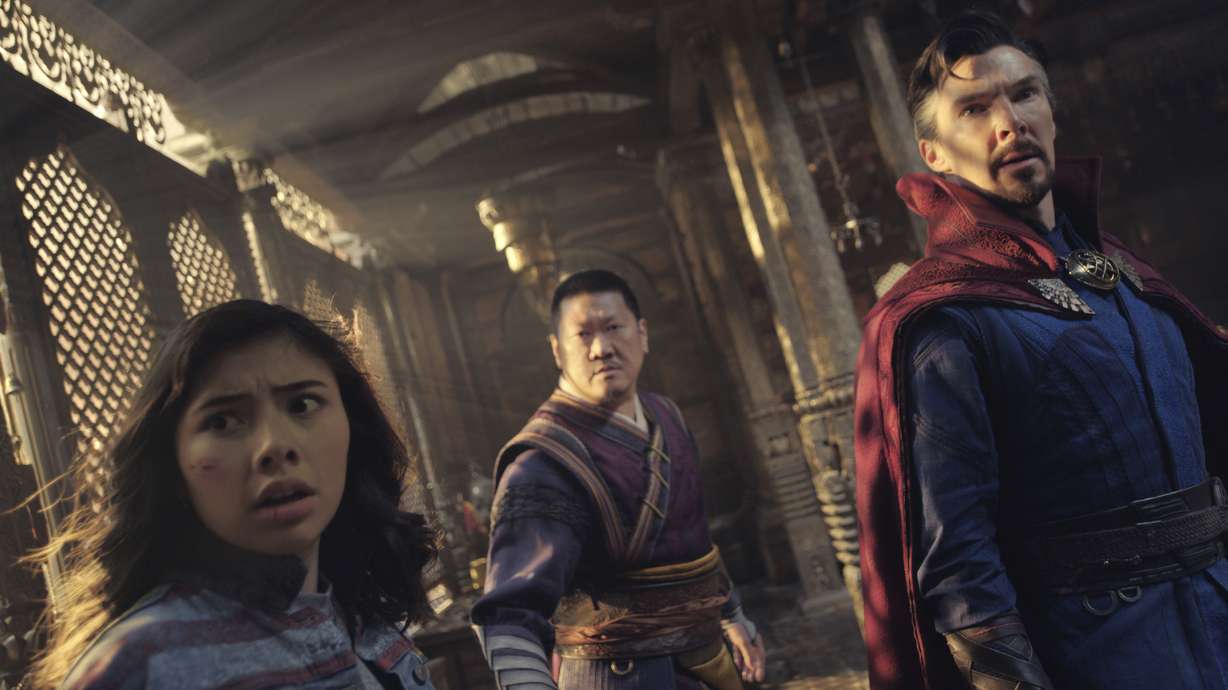 This image released by Marvel Studios shows, from left, Xochitl Gomez as America Chavez, Benedict Wong as Wong, and Benedict Cumberbatch as Dr. Stephen Strange in a scene from "Doctor Strange in the Multiverse of Madness."