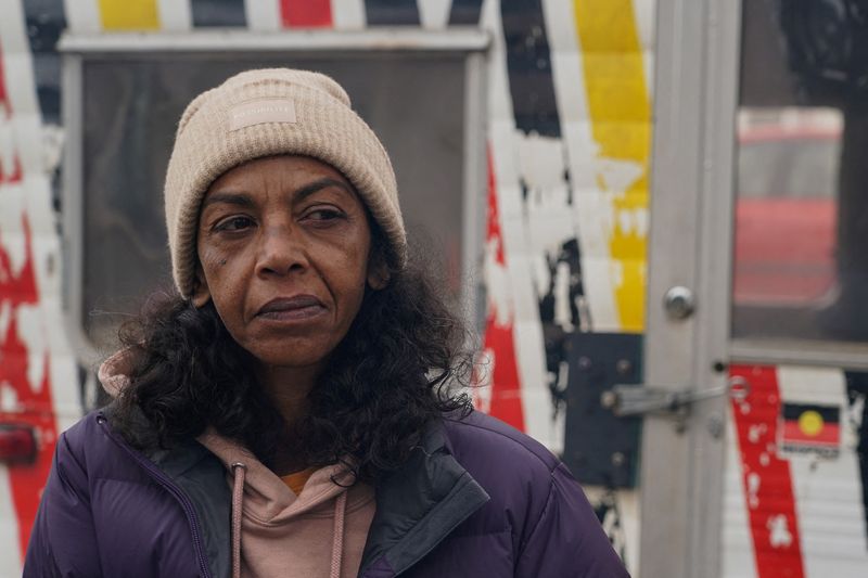 Gwenda Stanley, an Indigenous Australian of Gomeroi descent, stands by a campfire at the Aboriginal Tent Embassy, a site of protest since 1972, in Canberra, Australia, May 4. 