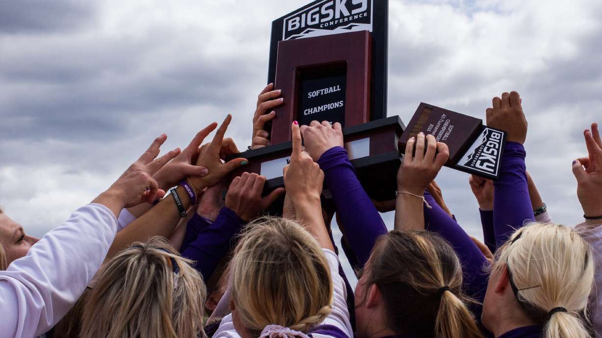 In this 2015 file photo, Weber State's softball team hoist the Big Sky Conference tournament championship trophy after defeating Sacramento State, 13-1, in five innings Saturday to win the Big Sky title. The Wildcats are headed to the Seattle Regional to face Texas after winning the conference regular season and tournament title.