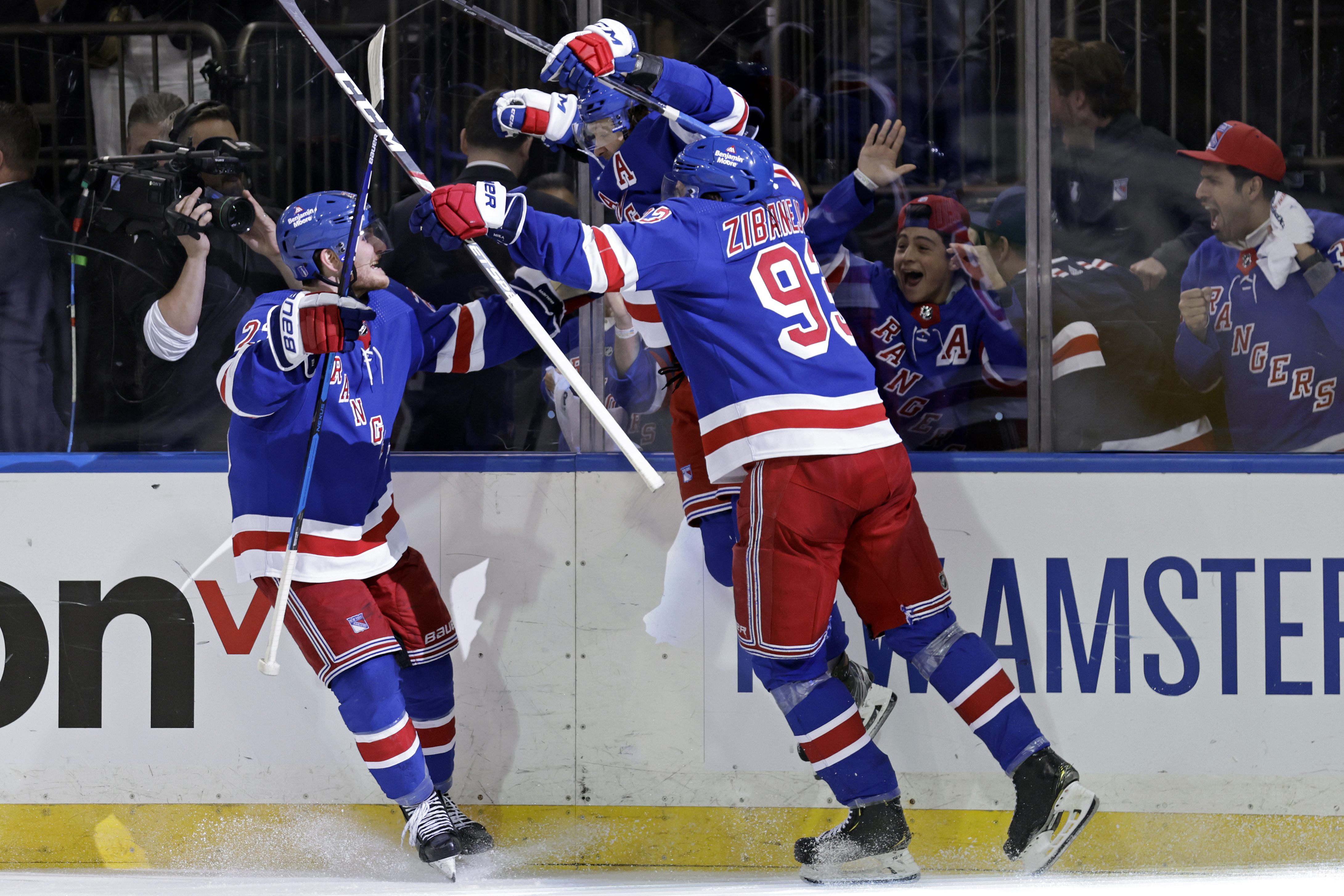 New York Rangers left wing Artemi Panarin (10) reacts with teammates after scoring the game winning goal against the Pittsburgh Penguins during overtime in Game 7 of an NHL hockey Stanley Cup first-round playoff series Sunday, May 15, 2022, in New York. The Rangers won 4-3 in overtime. 