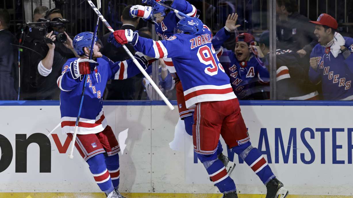 New York Rangers left wing Artemi Panarin (10) reacts with teammates after scoring the game winning goal against the Pittsburgh Penguins during overtime in Game 7 of an NHL hockey Stanley Cup first-round playoff series Sunday, May 15, 2022, in New York. The Rangers won 4-3 in overtime.