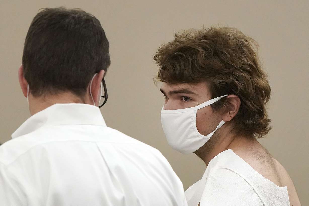 Payton Gendron talks with his attorney during his arraignment in Buffalo City Court, Saturday, in Buffalo, N.Y.