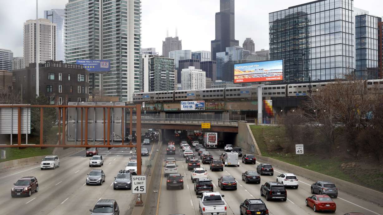 Traffic flows along Interstate 90 highway in Chicago on March 31, 2021. With upcoming data showing traffic deaths soaring, the Biden administration is steering $5 billion in federal aid to cities and localities to address the growing crisis.