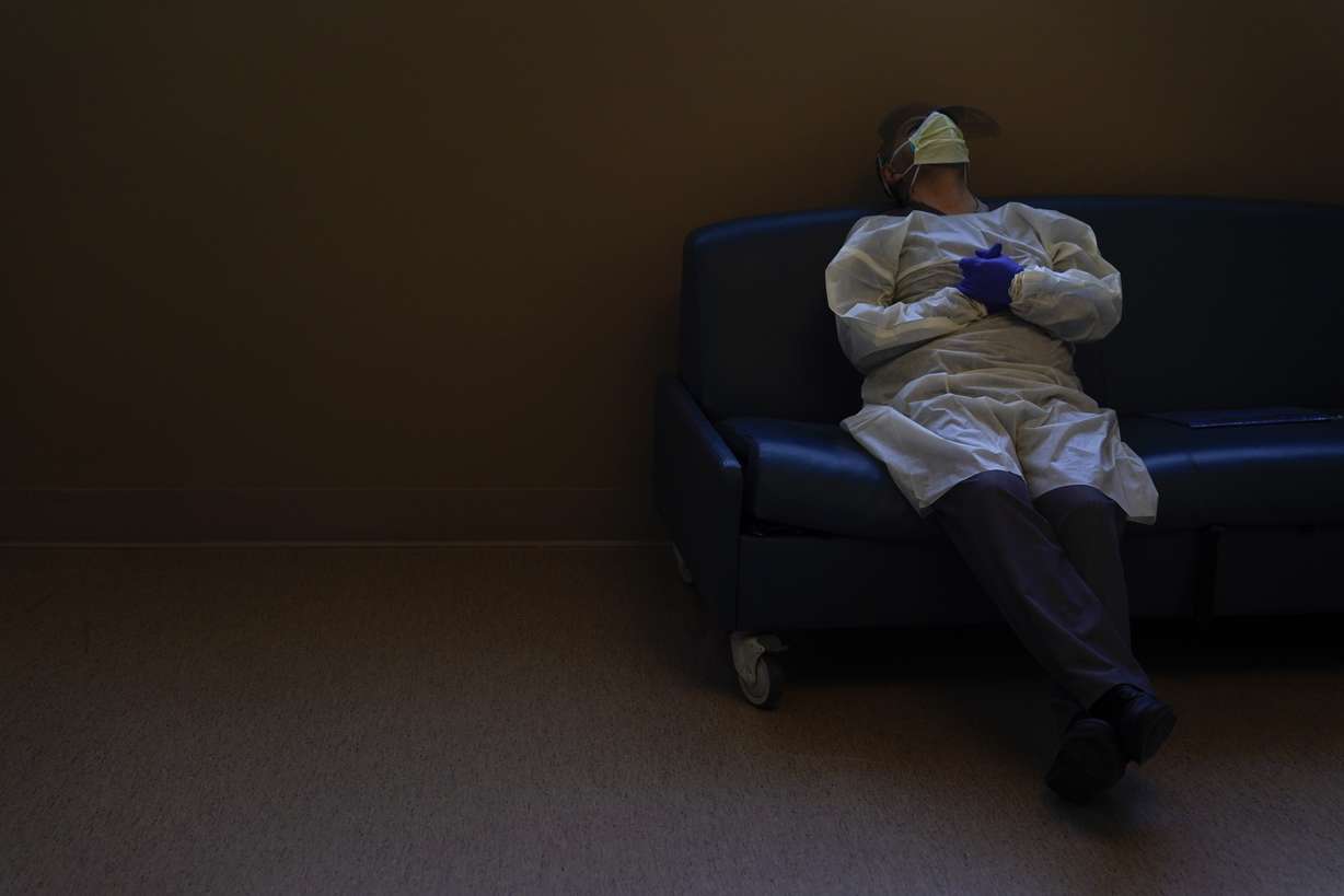 Dr. Mher Onanyan takes a short break while waiting for an X-ray of a COVID-19 patient's lungs at Providence Holy Cross Medical Center in the Mission Hills section of Los Angeles, Dec. 22, 2020.