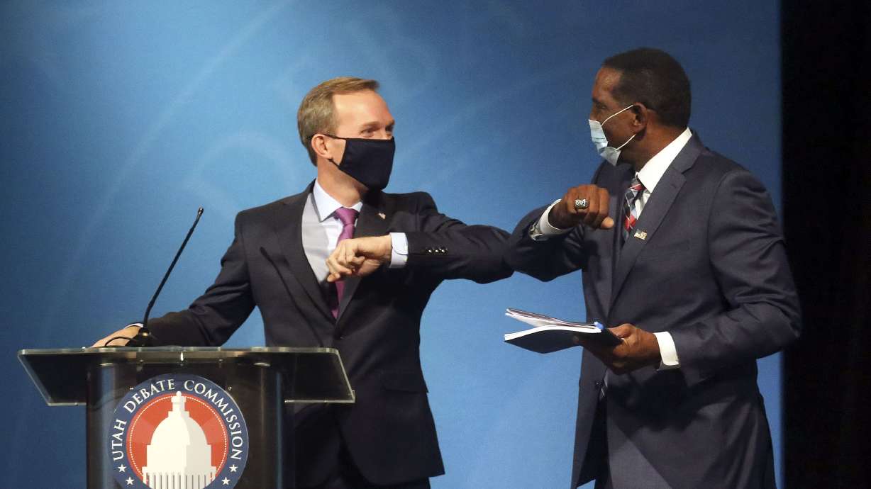 Then-Rep. Ben McAdams, D-Utah, and Burgess Owens bump elbows after participating in the 4th Congressional District debate at the Triad Center in Salt Lake City on Oct. 12, 2020. Citing concerns with the bipartisan Utah Debate Commission, the Utah Republican Party is moving ahead with plans to sponsor its own debates between primary contenders for Senate and Congress.