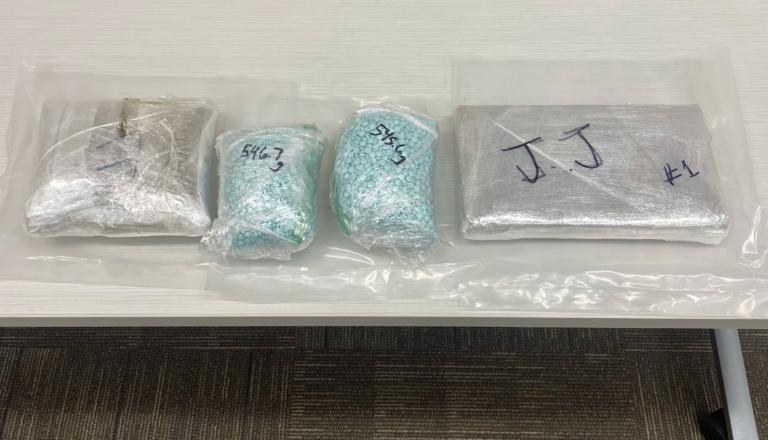 More than 2 pounds each of suspected cocaine, fentanyl pills and heroin were seized during a traffic stop in Washington, May 11.
