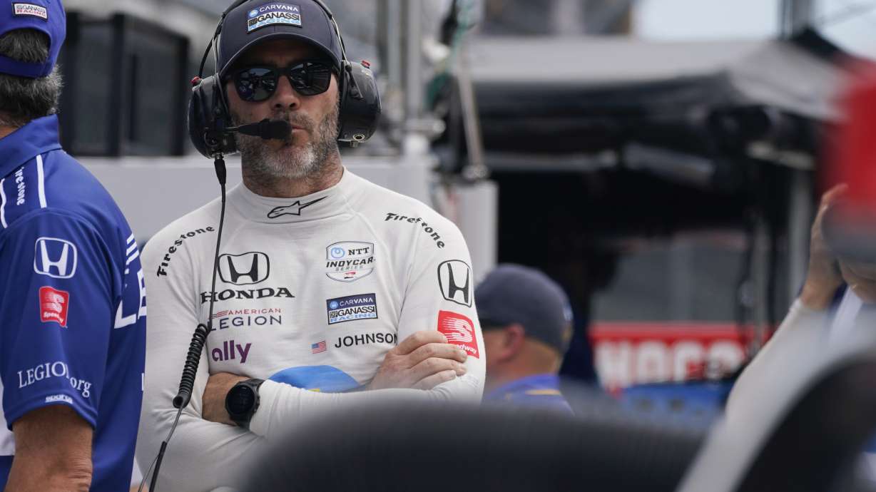 Jimmie Johnson stands on pit lane during practice for the Indianapolis 500 auto race at Indianapolis Motor Speedway, Tuesday, May 17, 2022, in Indianapolis.