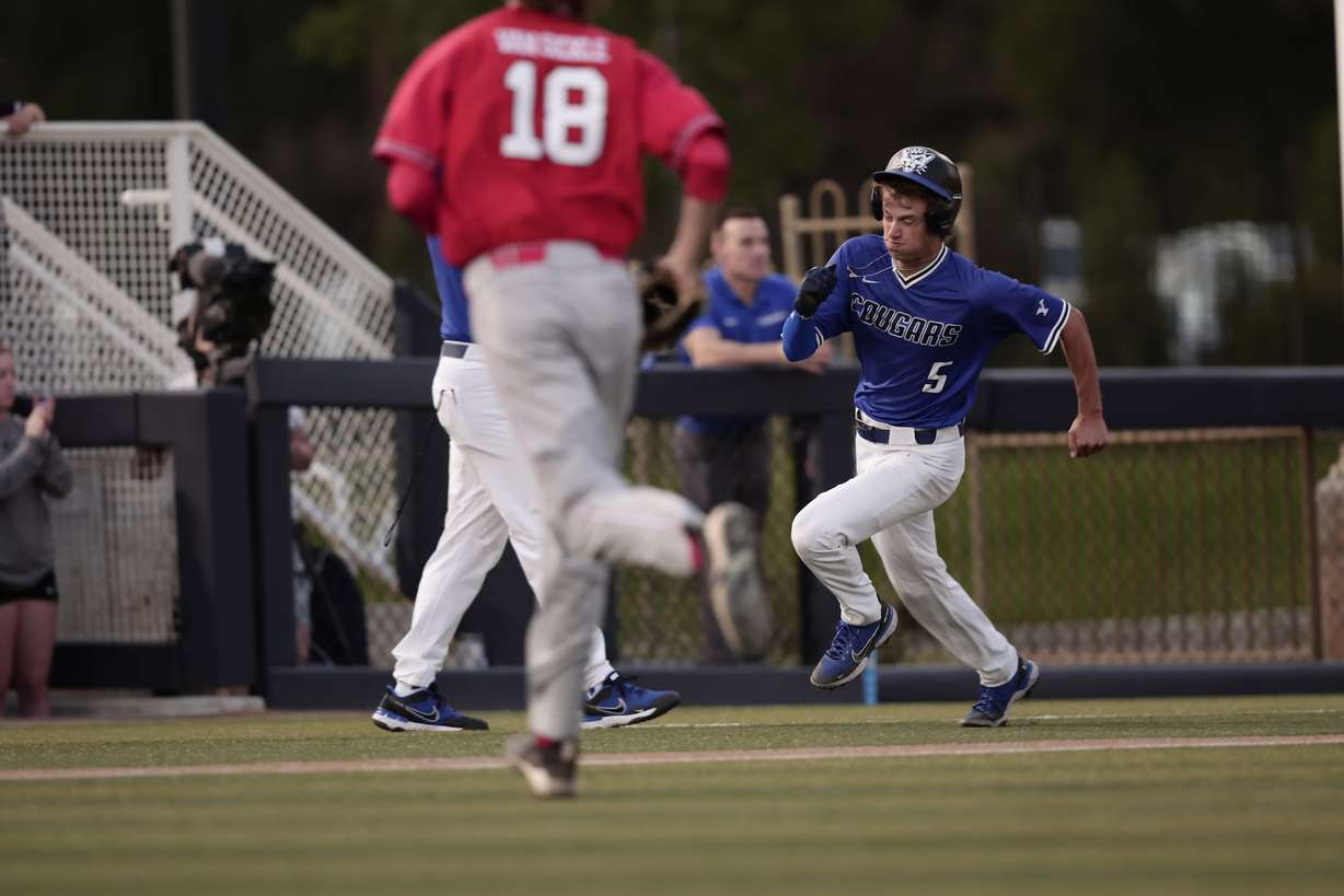 BYU's Ozzie Pratt rounds third base to score during a game against rival Utah, Tuesday, May 17, 2022. The Utes won, 12-7.