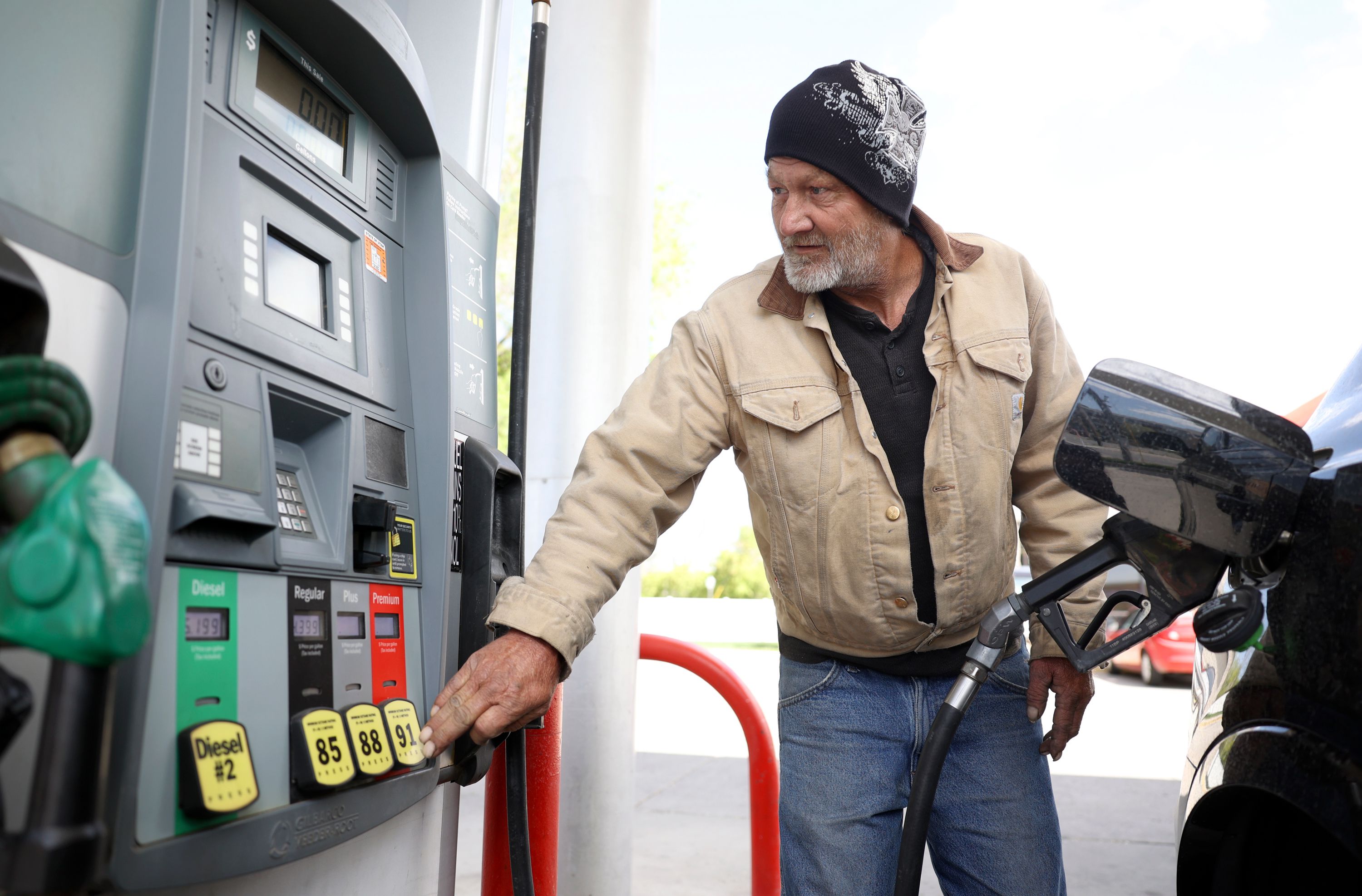 Charles Barnes fuels up at Shoppers Express in Salt Lake City on May 10. The average price of gas hit an all-time high on Wednesday of $4.57 per gallon.