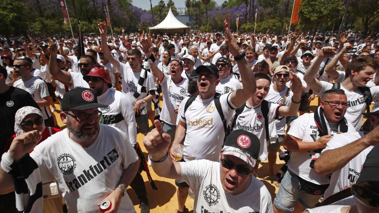 Eintracht supporters react in downtown Seville, Spain, Wednesday, May 18, 2022. Eintracht Frankfurt will play Glasgow Rangers in the Europa League final Wednesday evening in Seville.