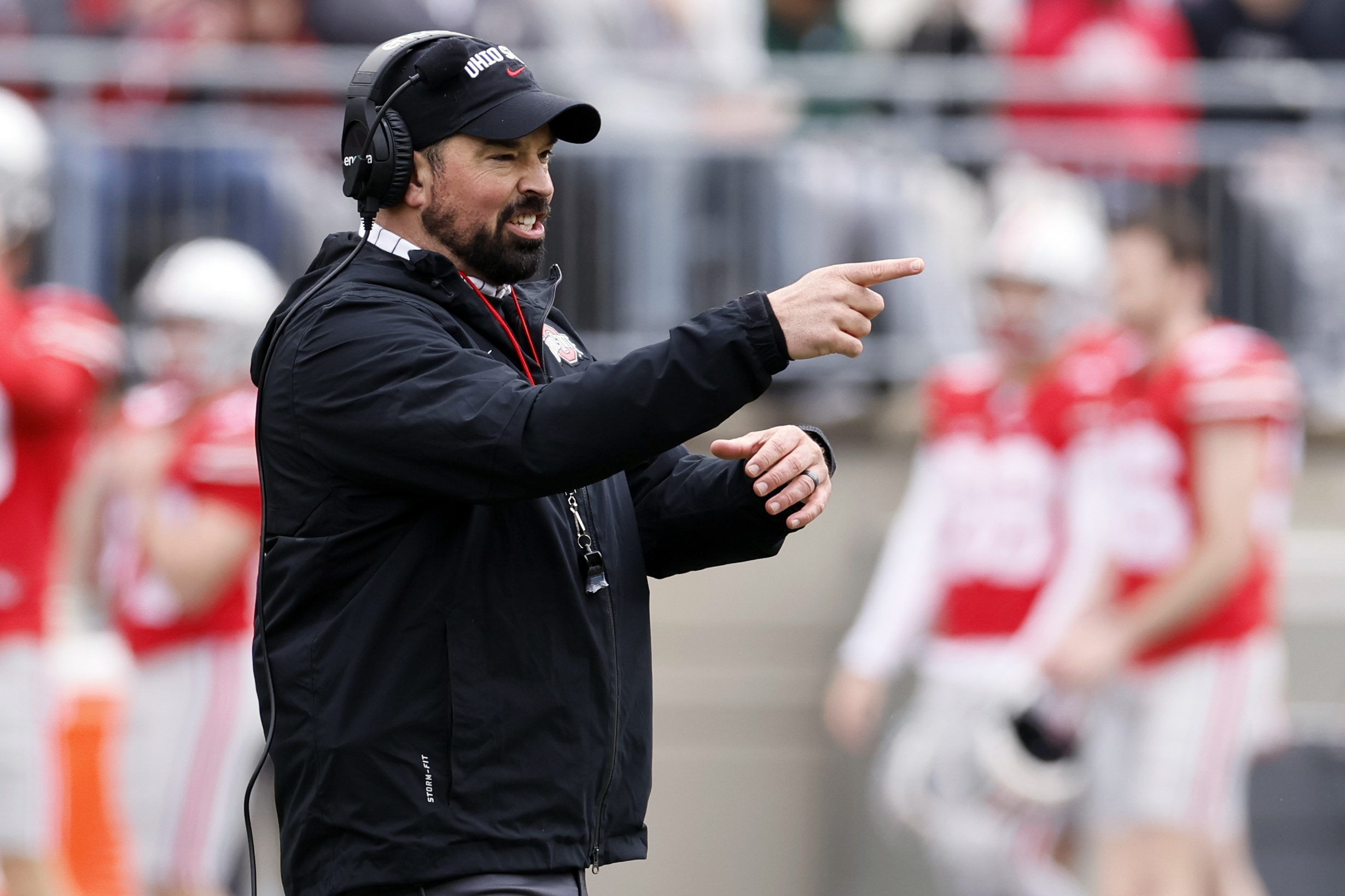 FILE - Ohio State head coach Ryan Day directs his team during an NCAA college spring football game on April 16, 2022, in Columbus, Ohio. Ohio State is hiking Day's annual salary to $9.5 million, as part of a two-year contract extension that will put him among the nation's highest-paid college football coaches.