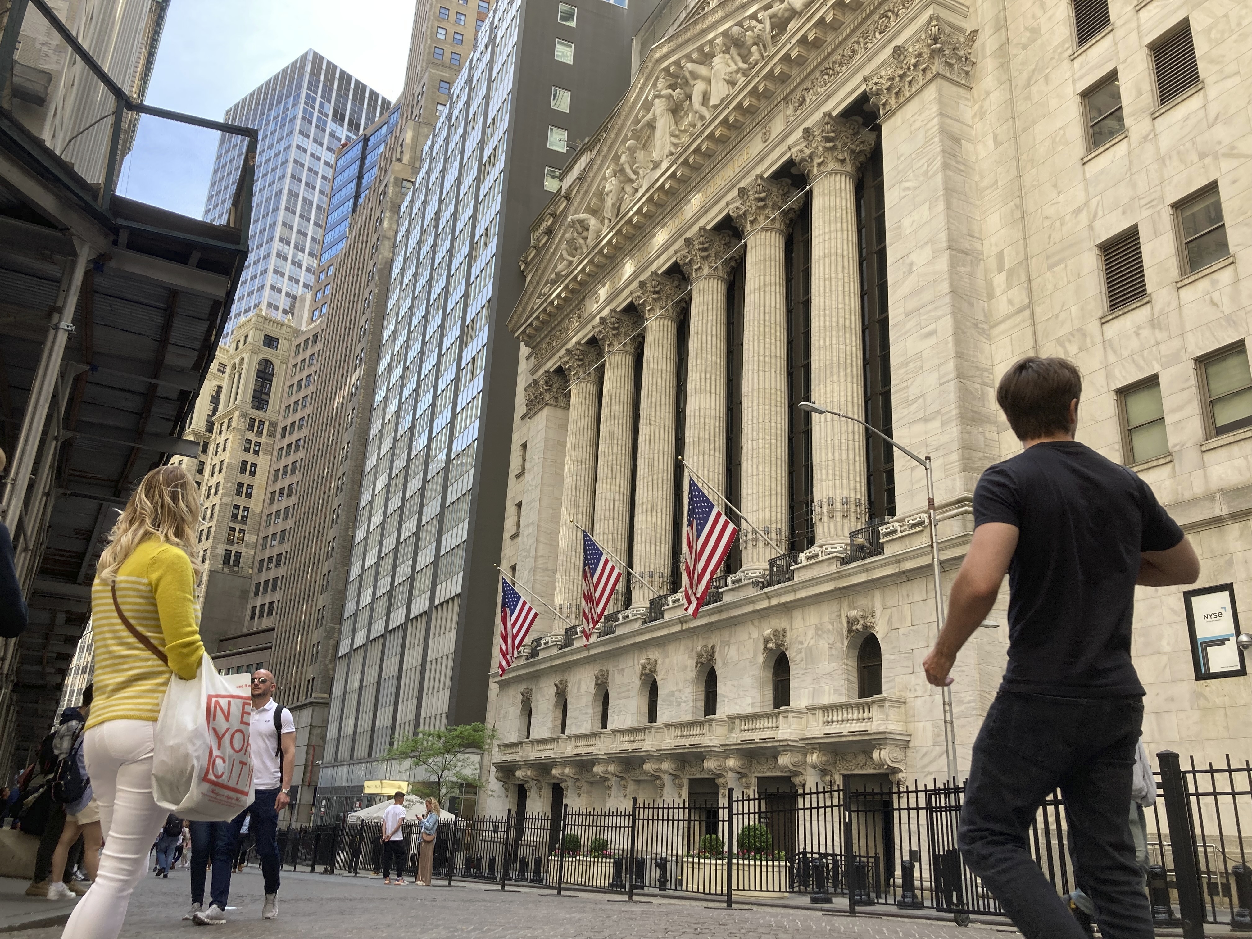 Pedestrians walk by the New York Stock Exchange, Wednesday in New York. The stock market's skid this year has pulled the S&P 500 close to what's known as a bear market.