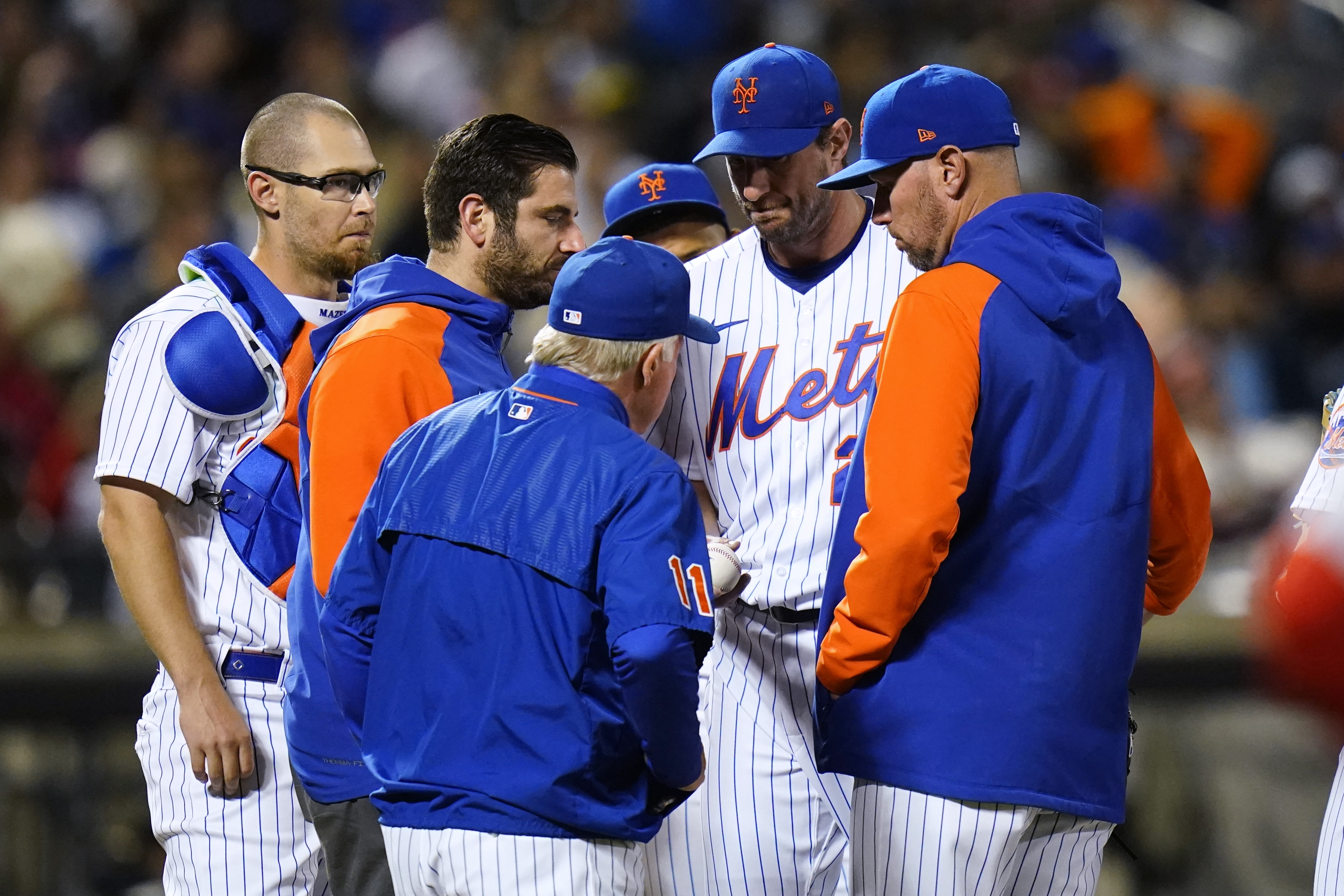 New York Mets starting pitcher Max Scherzer hands the ball to manager Buck Showalter during the sixth inning of the team's baseball game against the St. Louis Cardinals on Wednesday, May 18, 2022, in New York. 