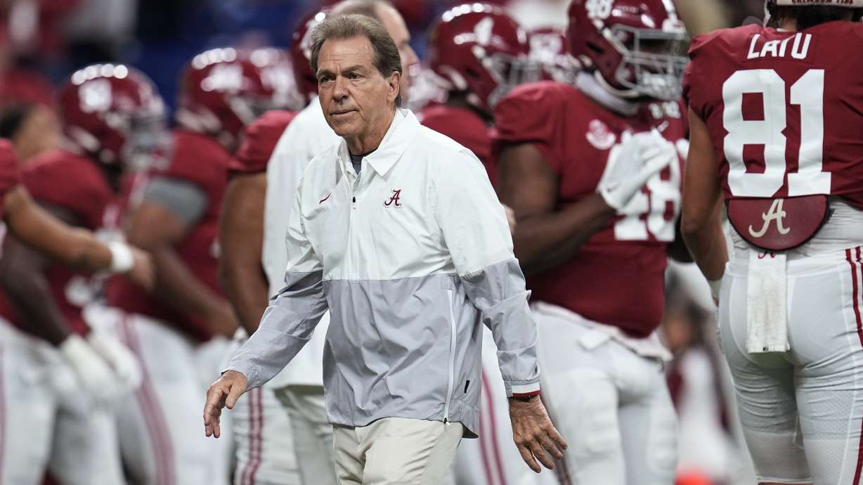 FILE - Alabama coach Nick Saban watches players warm up for the College Football Playoff championship NCAA football game against Georgia on Jan. 10, 2022, in Indianapolis. Saban called out Texas A&M on Wednesday night, May 18 for “buying” players in its top-ranked recruiting class with name, image and likeness deals, saying Crimson Tide football players earned more than $3 million last year “the right way.”