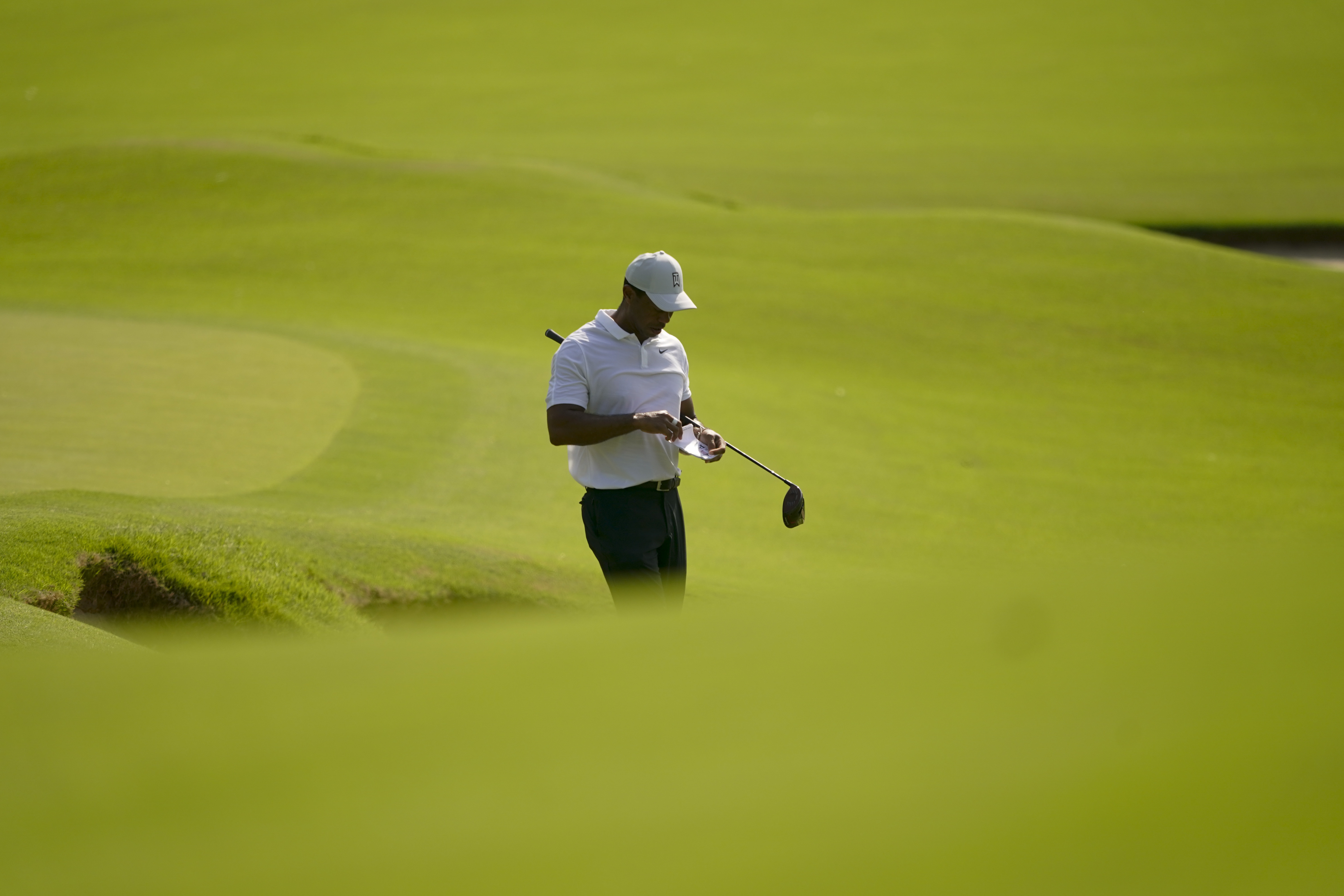 Tiger Woods plays the second hole during a practice round for the PGA Championship golf tournament, Wednesday, May 18, 2022, in Tulsa, Okla. 