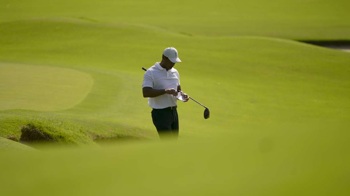 Tiger Woods plays the second hole during a practice round for the PGA Championship golf tournament, Wednesday, May 18, 2022, in Tulsa, Okla.