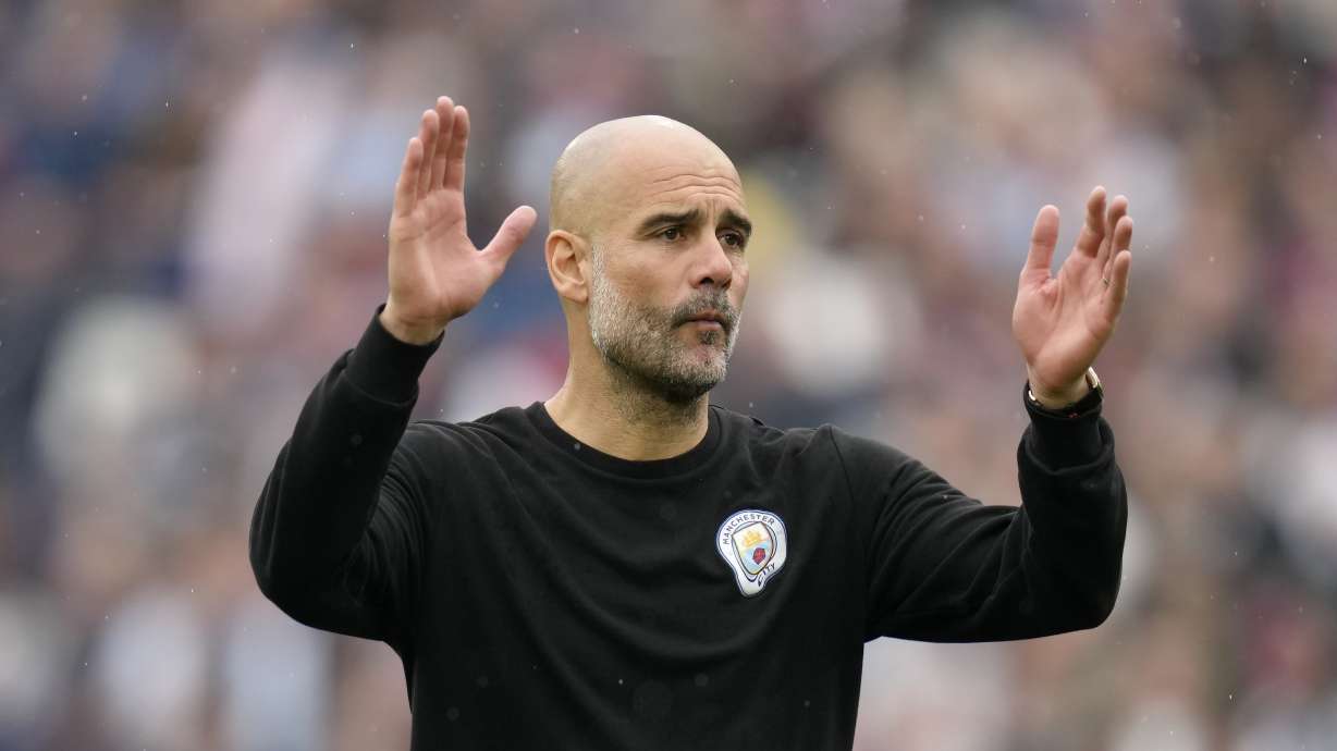 Manchester City's head coach Pep Guardiola reacts at the end of the English Premier League soccer match between West Ham United and Manchester City at London stadium in London, Sunday, May 15, 2022.