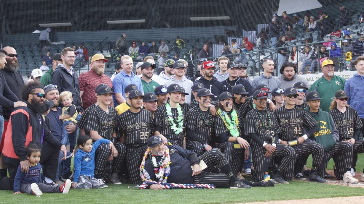 Kearns baseball coach Dave Ballard celebrates his final home game after a 30-year coaching career with current and former players at Gates Field in Kearns.