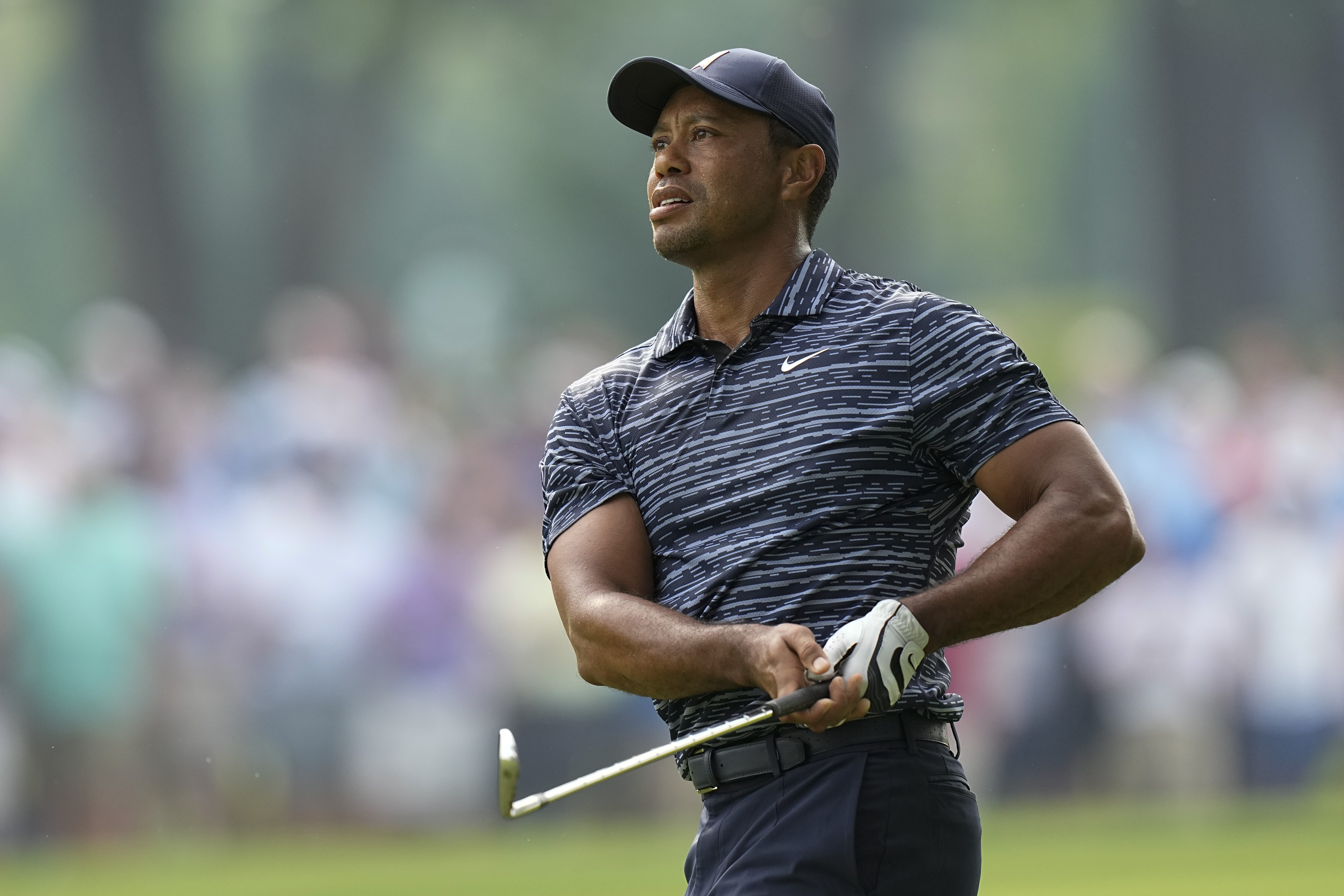 Tiger Woods hits from the fairway on the 13th hole during the first round of the PGA Championship golf tournament, Thursday, May 19, 2022, in Tulsa, Okla. 