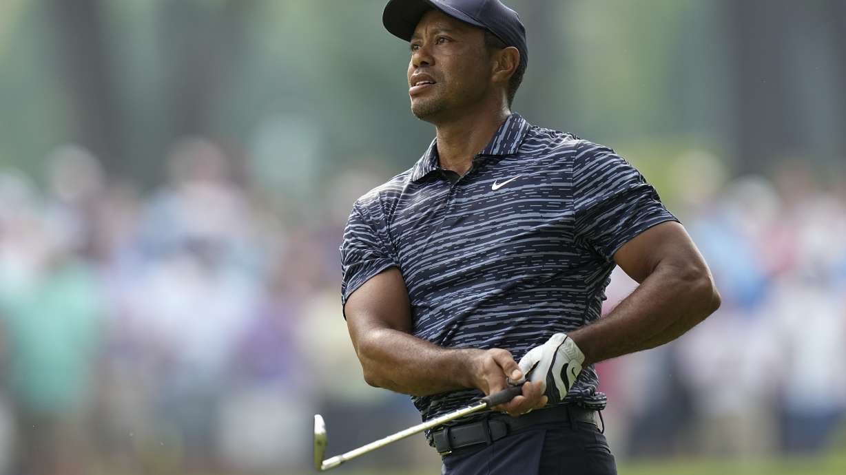 Tiger Woods hits from the fairway on the 13th hole during the first round of the PGA Championship golf tournament, Thursday, May 19, 2022, in Tulsa, Okla.