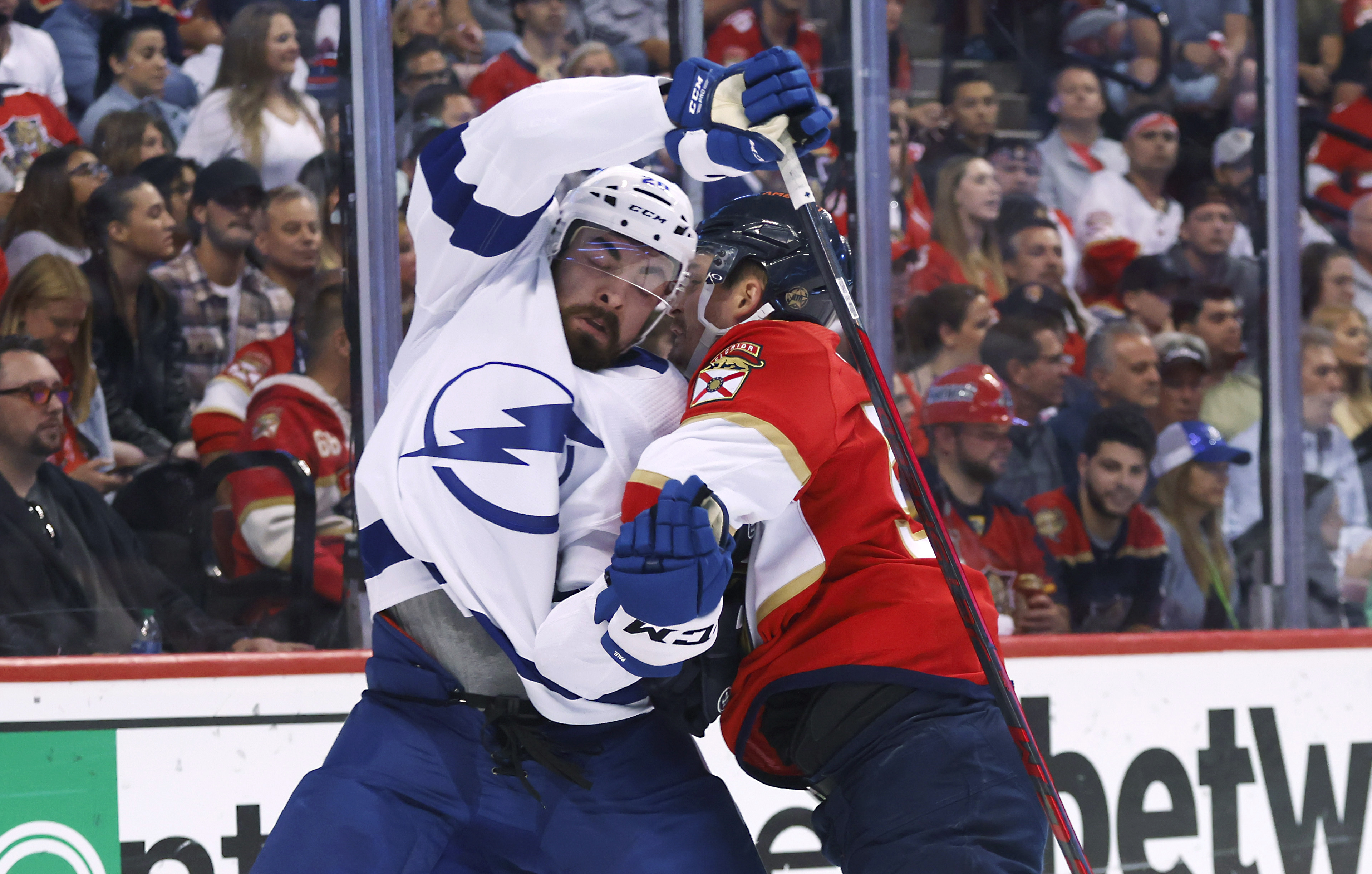 Florida Panthers center Noel Acciari, right, knocks Tampa Bay Lightning left wing Nicholas Paul (20) off the puck during the first period of Game 2 of an NHL hockey second-round playoff series Thursday, May 19, 2022, in Sunrise, Fla. 