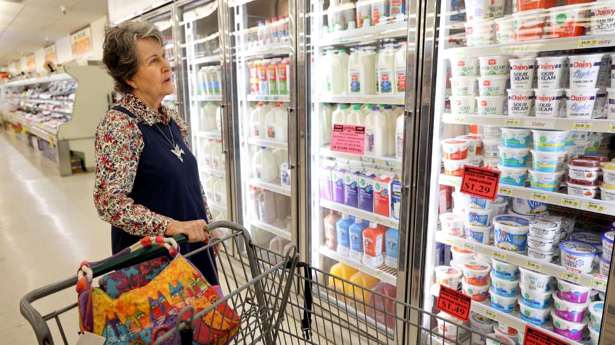 Carolyn Adamson shops at a Reams in Sandy on Wednesday. Though inflation cooled slightly last month, U.S. consumers are still paying significantly more for nearly everything they buy. If that’s the bad news, the good — or at least slightly better — news is that not all price increases are created equal, meaning consumers can reduce their personal inflation rate if they know where to cut back.