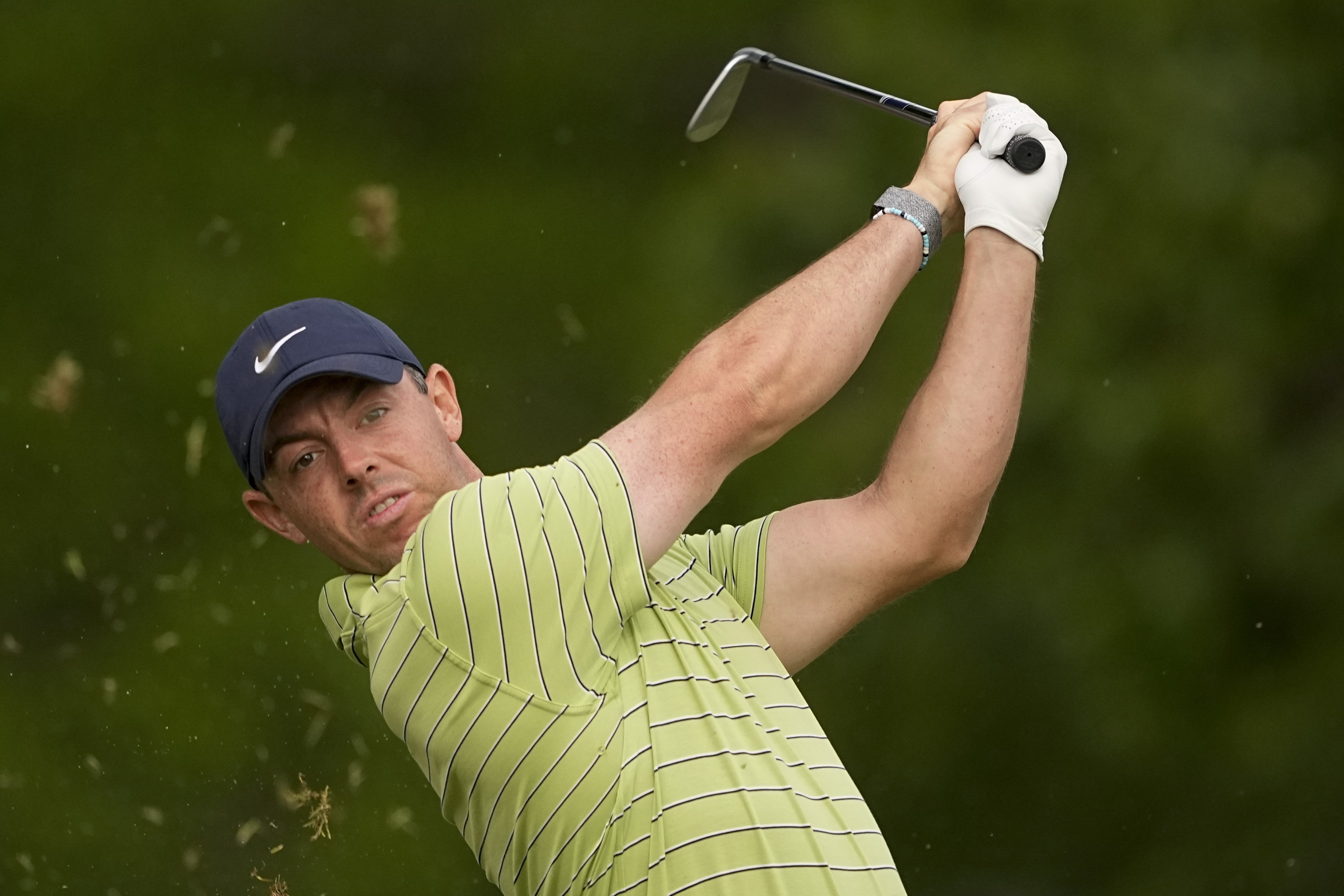 Rory McIlroy, of Northern Ireland, watches his tee shot on the 11th hole during the first round of the PGA Championship golf tournament Thursday, May 19, 2022, in Tulsa, Okla. 