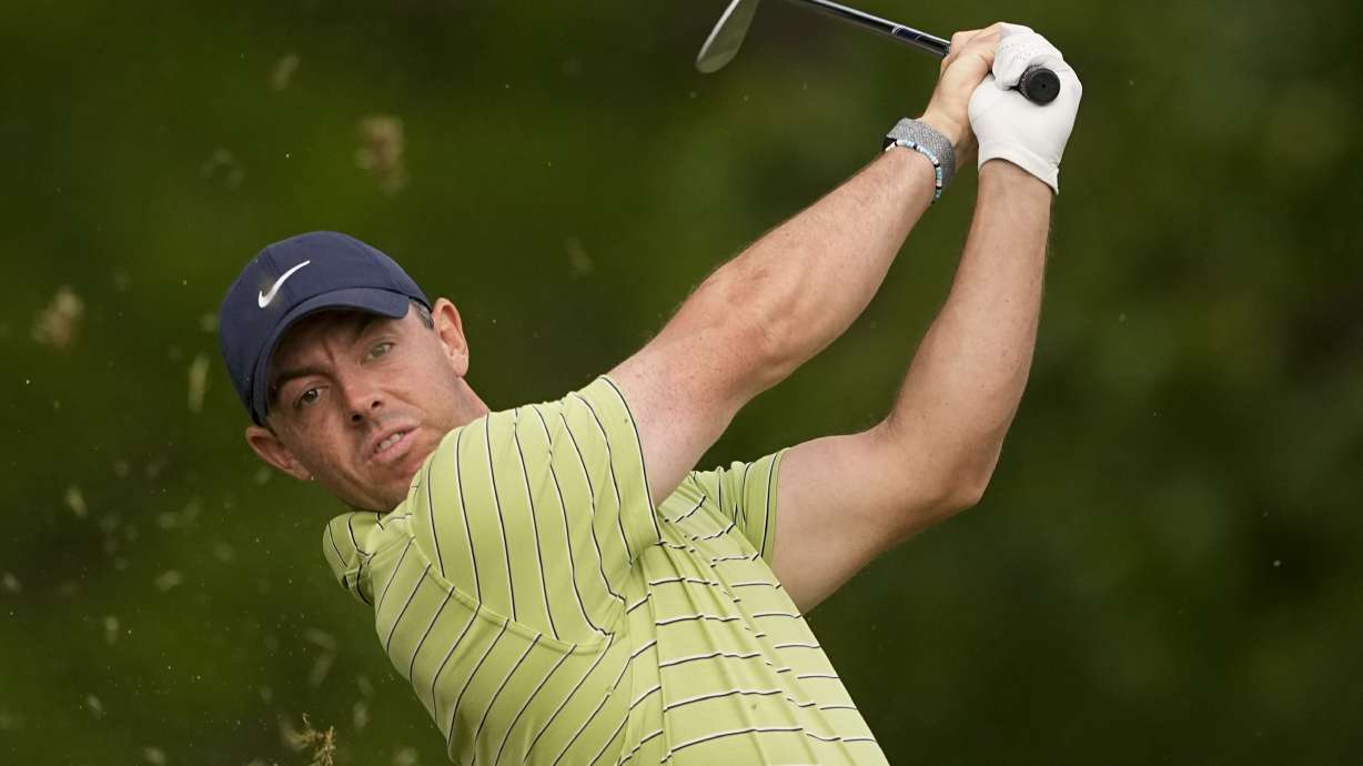 Rory McIlroy, of Northern Ireland, watches his tee shot on the 11th hole during the first round of the PGA Championship golf tournament Thursday, May 19, 2022, in Tulsa, Okla.