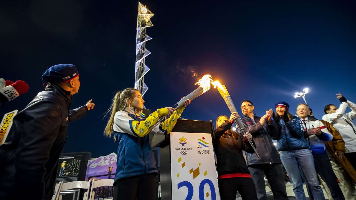 Gabrielle Harris, of Team Soldier Hollow Cross Country and Biathlon, and YiYi O’Brien, National Abilities Center Youth Adaptive Program athlete, mark the 20th anniversary of the 2002 Winter Games at Rice-Eccles Stadium by lighting torches from 2002 at Rice-Eccles Stadium in Salt Lake City on Feb. 8. The site of the 2030 Winter Games could all but be decided in the coming months now that International Olympic Committee leaders are ready to start negotiating.