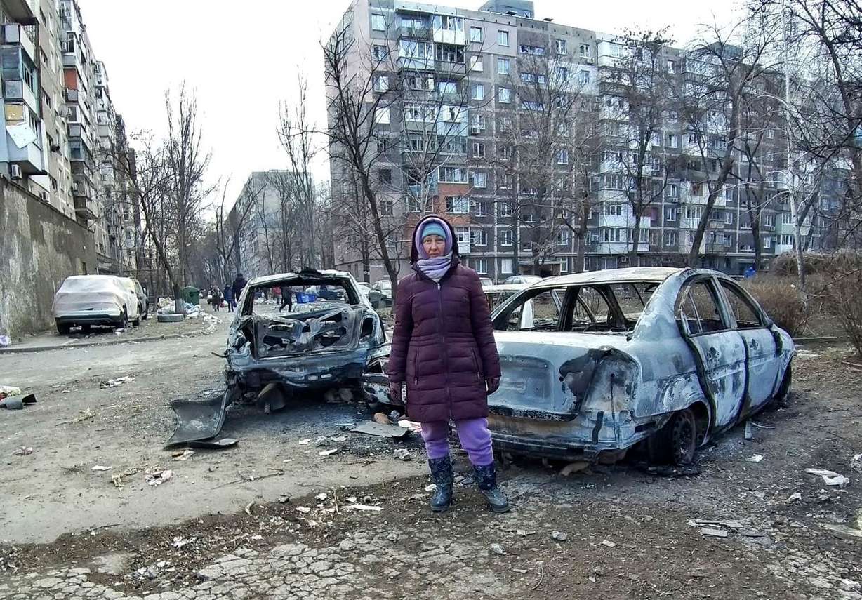 Ukrainian refugee Anzhela Kumurxhi poses for a photo in Mariupol, Ukraine.