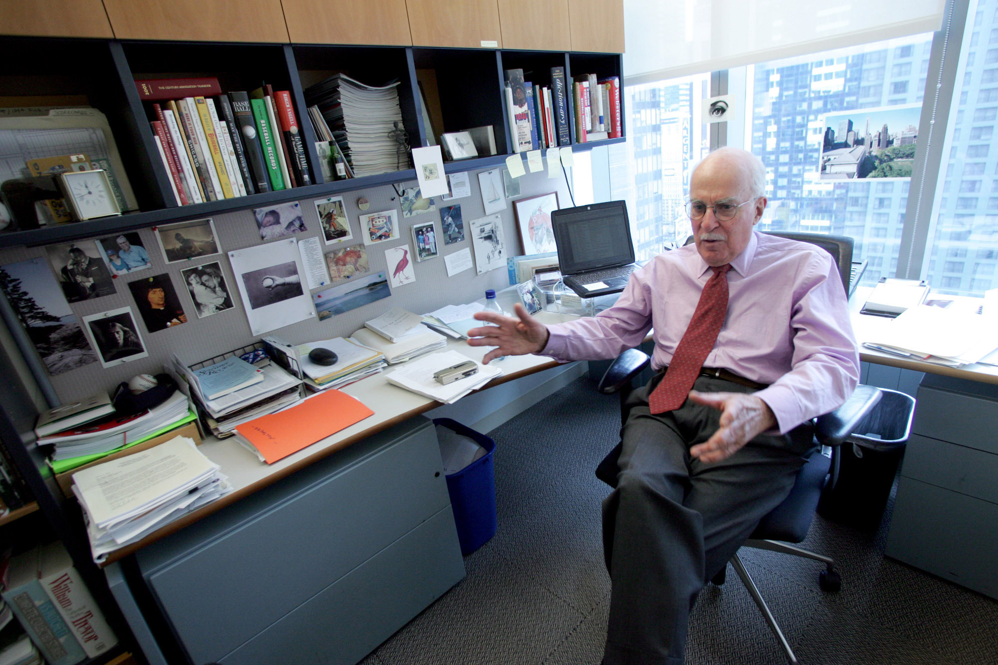FILE - Author Roger Angell gestures during an interview at his office at the New Yorker magazine on April 4, 2006, in New York. Angell, a longtime New Yorker writer and editor, has died the New Yorker announced Friday, May 20, 2022. He was 101. Angell, the son of founding New Yorker editor Katharine White and stepson of E.B. White, contributed hundreds of essays and stories to the magazine over a 70-year career. 