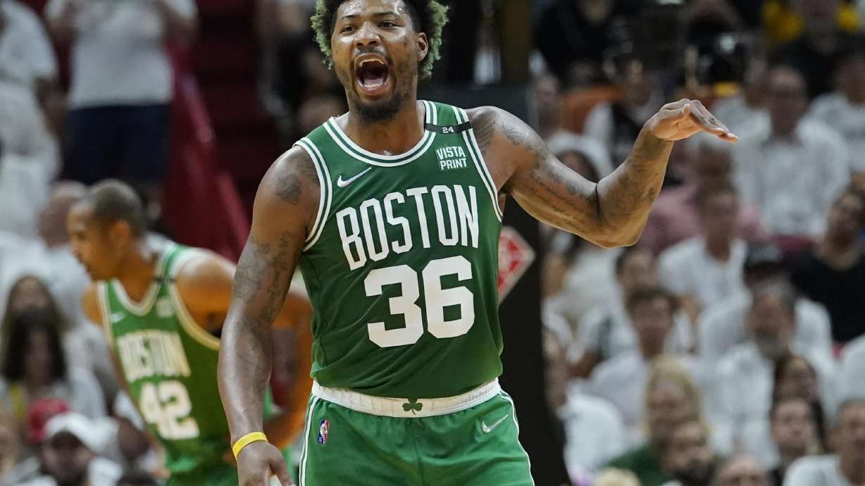 Boston Celtics guard Marcus Smart (36) gestures during the first half of Game 2 of the NBA basketball Eastern Conference finals playoff series against the Miami Heat, Thursday, May 19, 2022, in Miami.