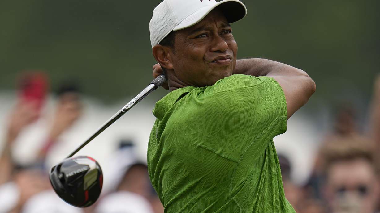 Tiger Woods watches his tee shot on the second hole during the second round of the PGA Championship golf tournament at Southern Hills Country Club, Friday, May 20, 2022, in Tulsa, Okla.