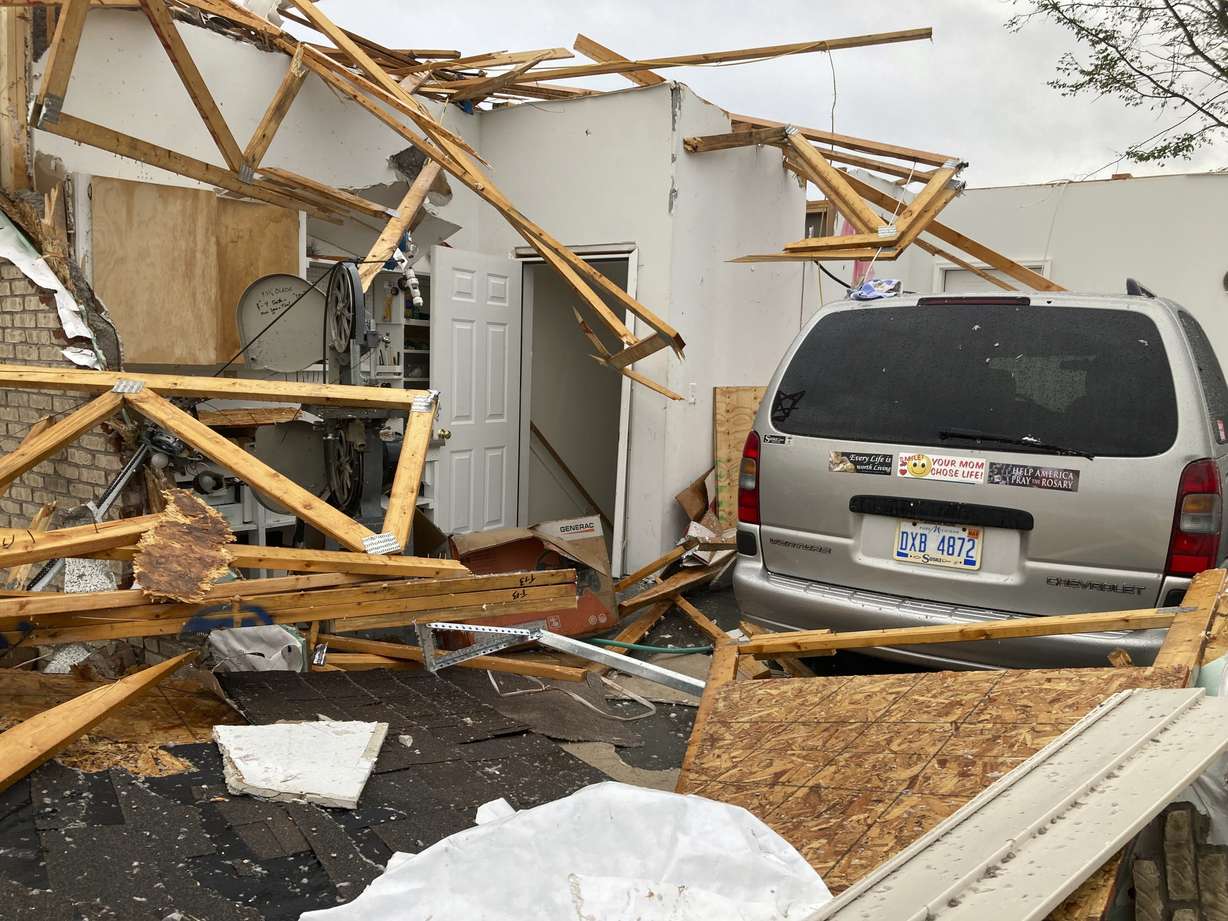 Damage is seen at the home of Betty Wisniewski after a tornado came through the area in Gaylord, Mich., Friday. Wisniewski's son said she escaped unharmed.