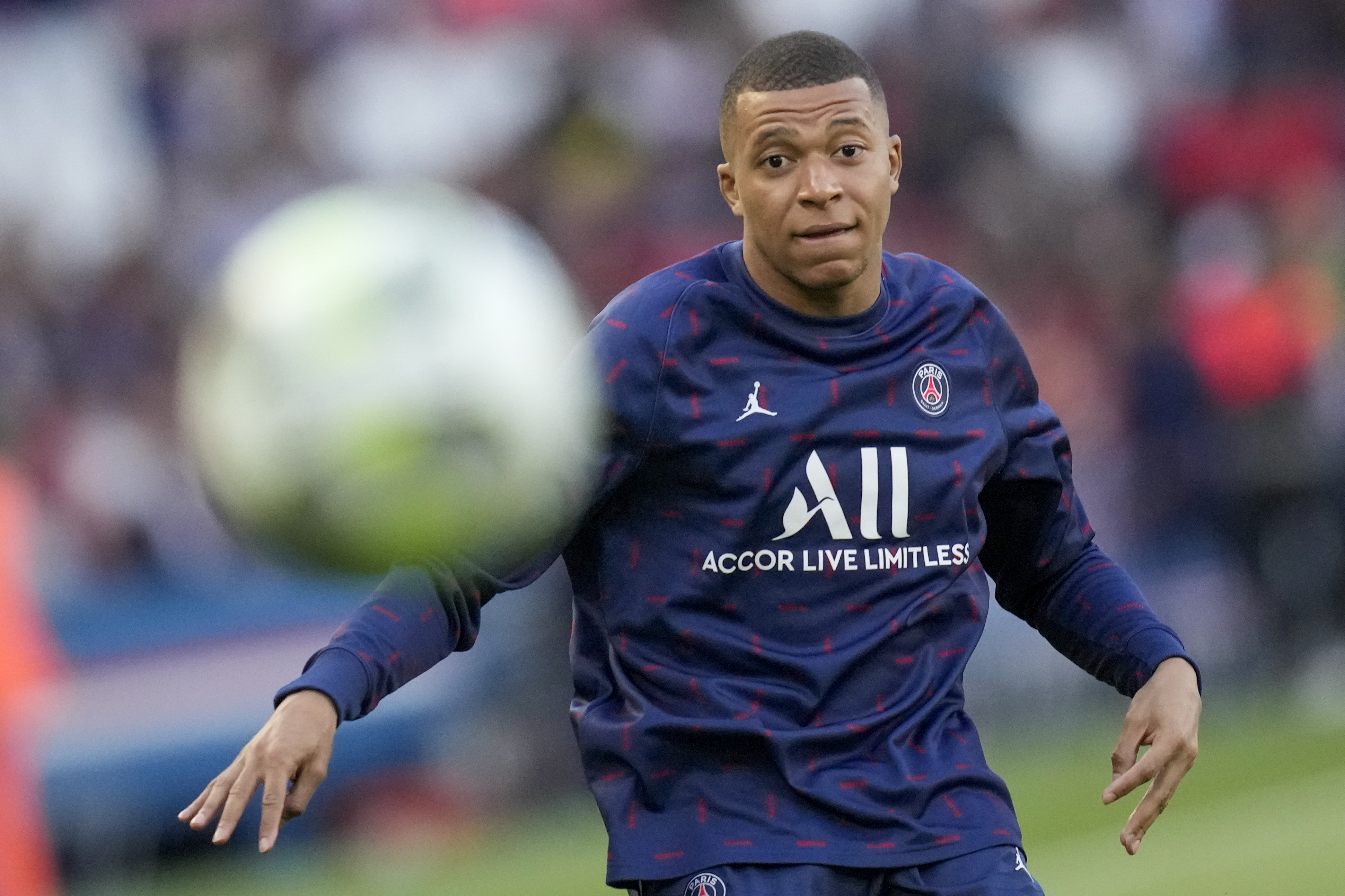 PSG's Kylian Mbappe warms up prior to the start of the French League One soccer match between Paris Saint Germain and Troyes at the Parc des Princes stadium in Paris, Sunday, May 8, 2022.